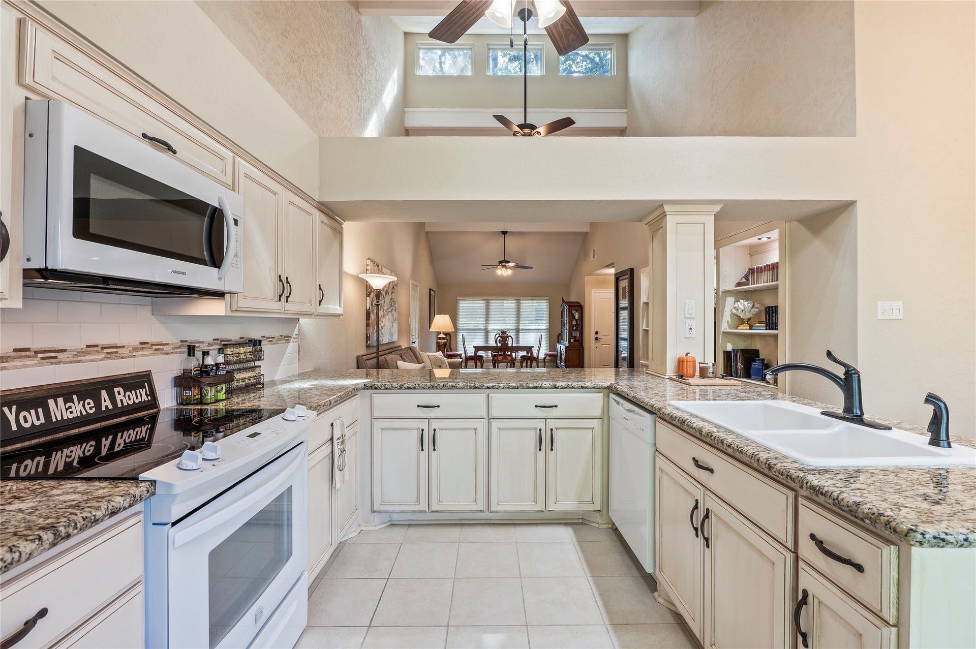 16530 Space Center Boulevard, Houston, TX 77058 Electric range and oven with built in microwave. Large cermaic double sink.