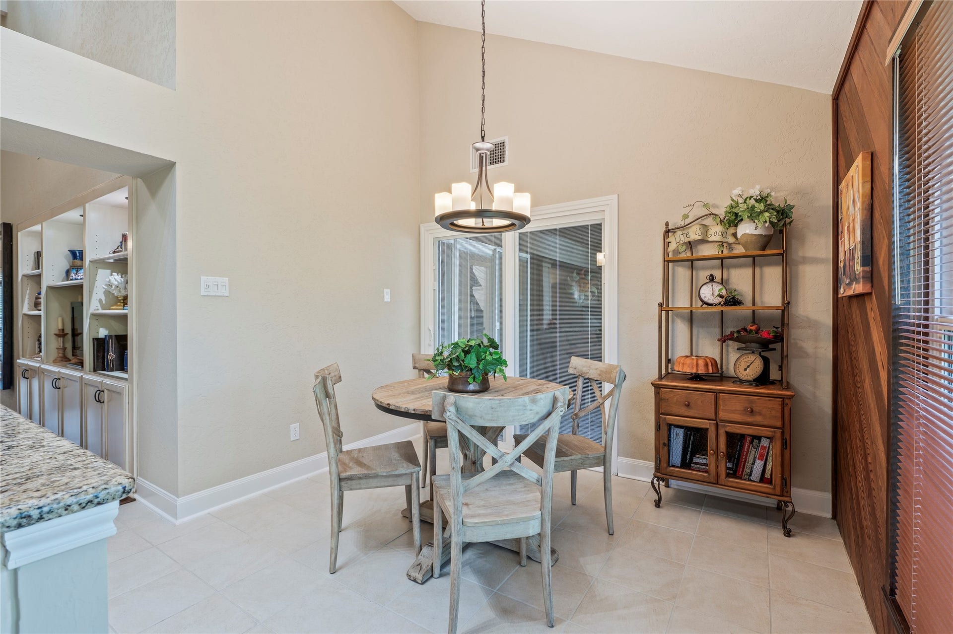 16530 Space Center Boulevard, Houston, TX 77058 spacious breakfast area with tile flooring and back patio access.