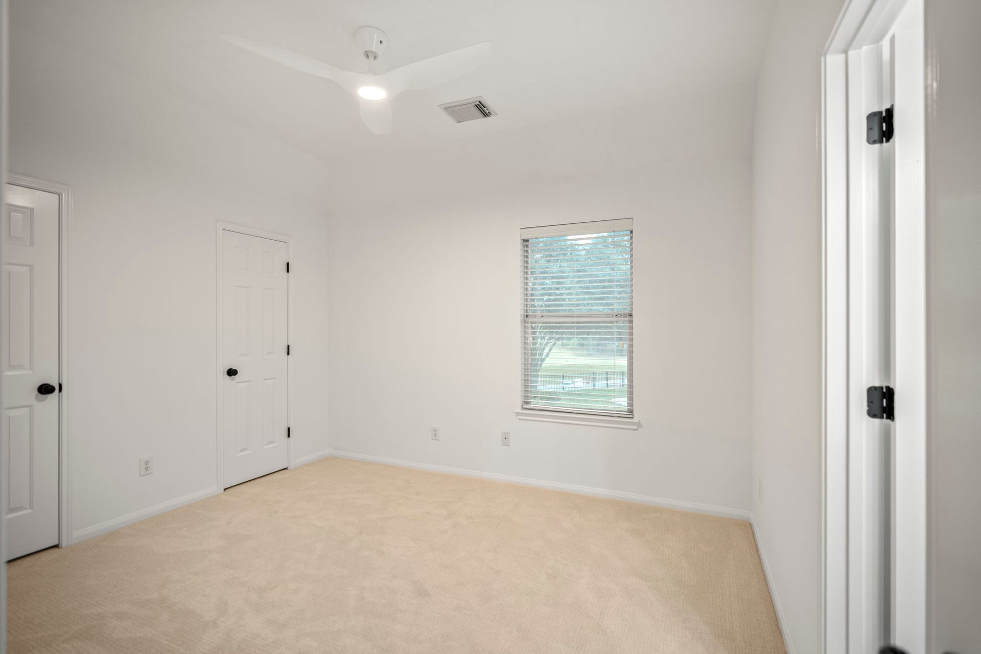 This is the fourth bedroom, which is upstairs, has a window and ceiling light and nice sized closet.