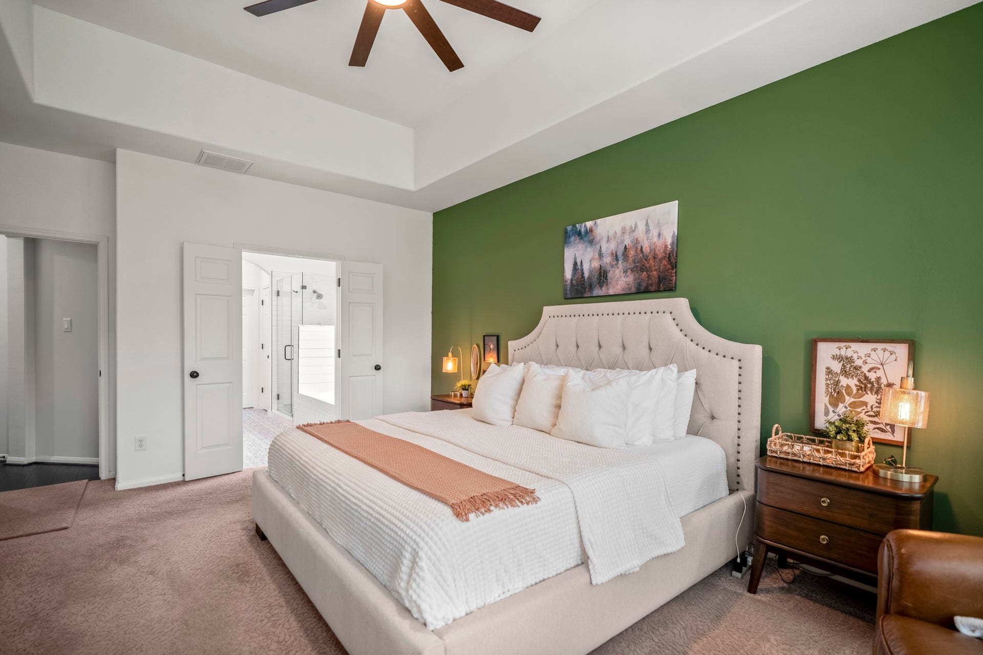 The primary bedroom is large enough for a king size bedroom set. Double doors lead to the en-suite bathroom.