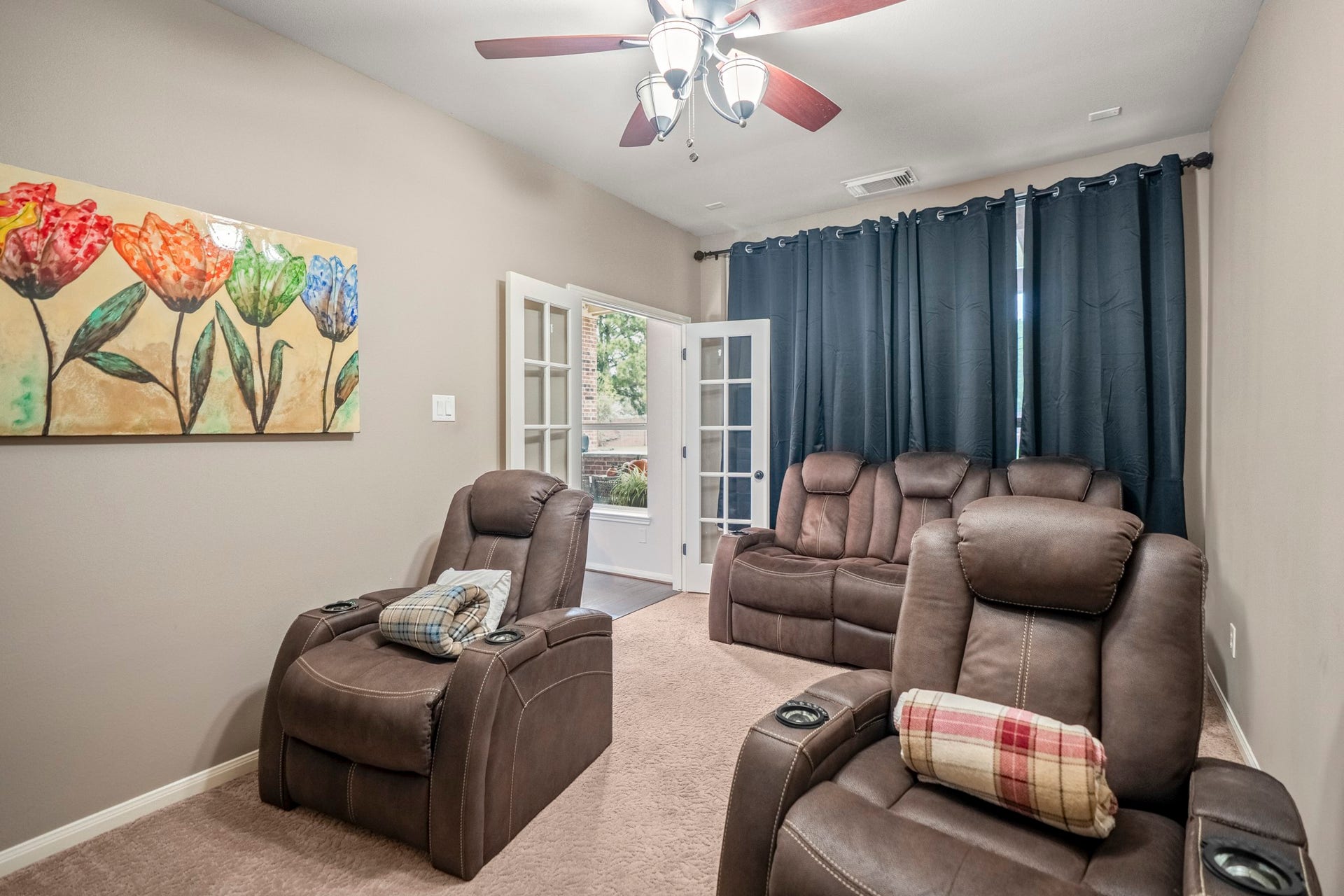French doors lead to the media room, this could be a flex space for your family to use as your needs require.