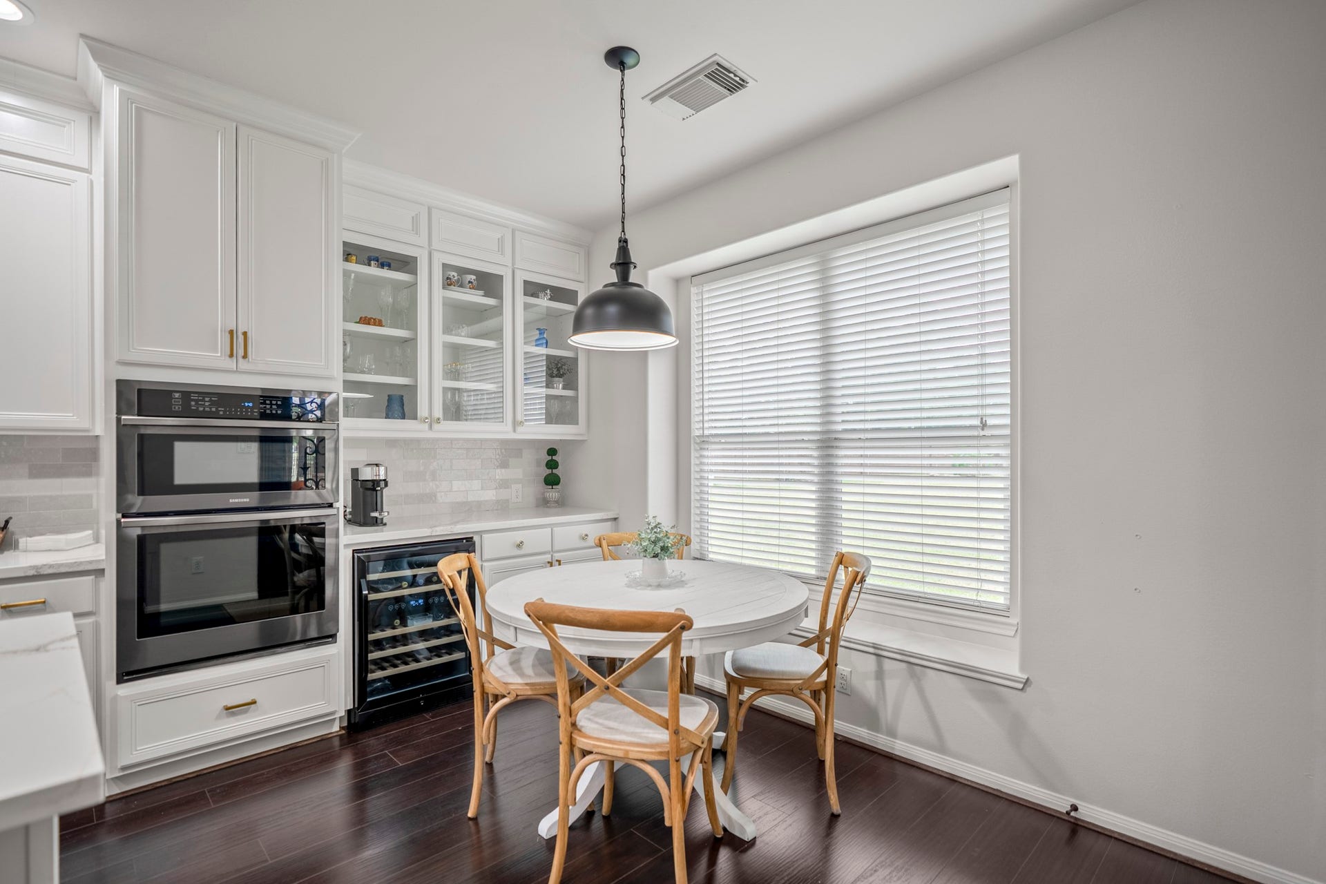 The large window floods the breakfast room with natural light, creating a warm and welcoming space to start your morning.