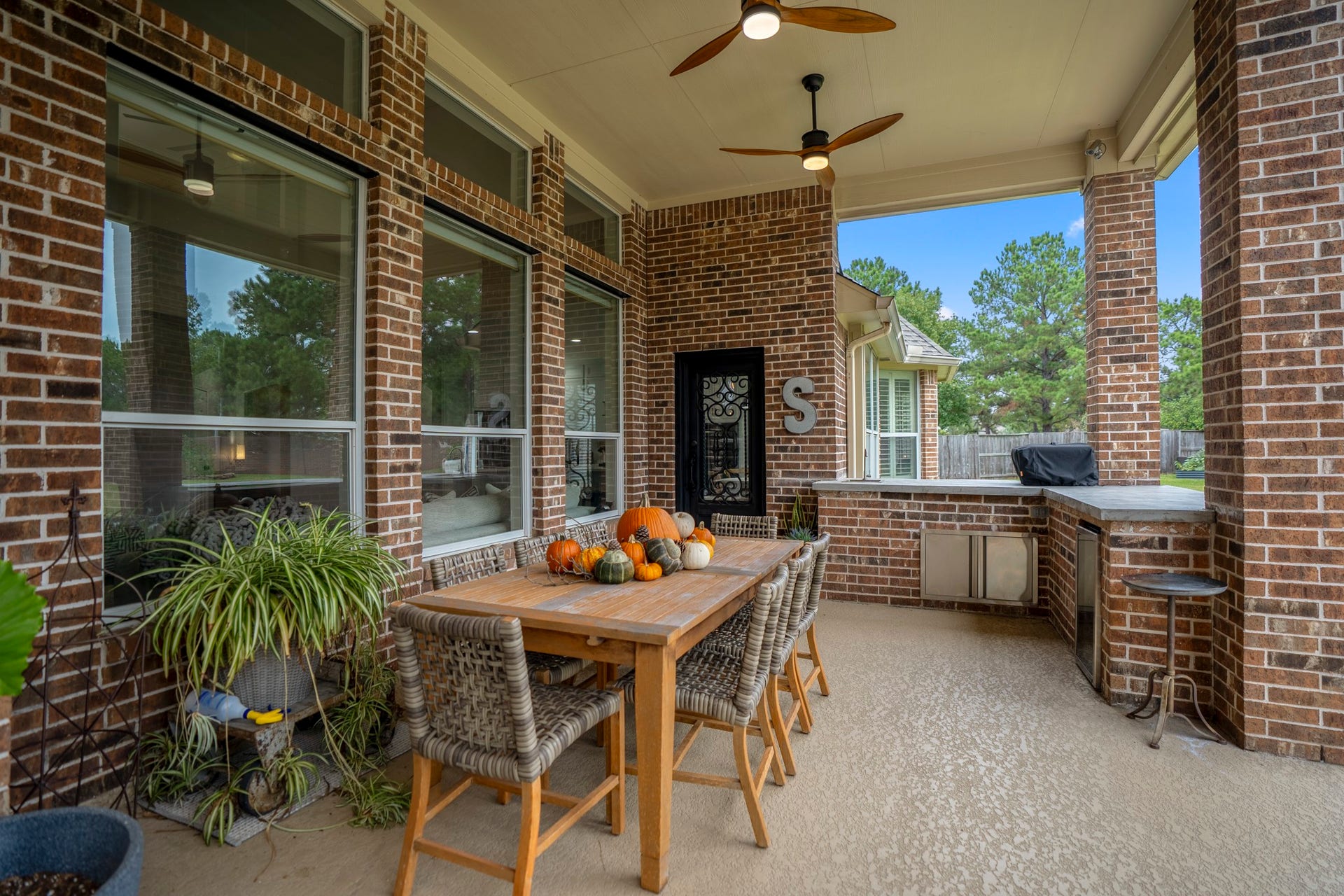 This is more than a beautiful home its where special moments take shape - notice the custom wrought iron back door is cohesive with the front iron door (and surround). A real special feature.