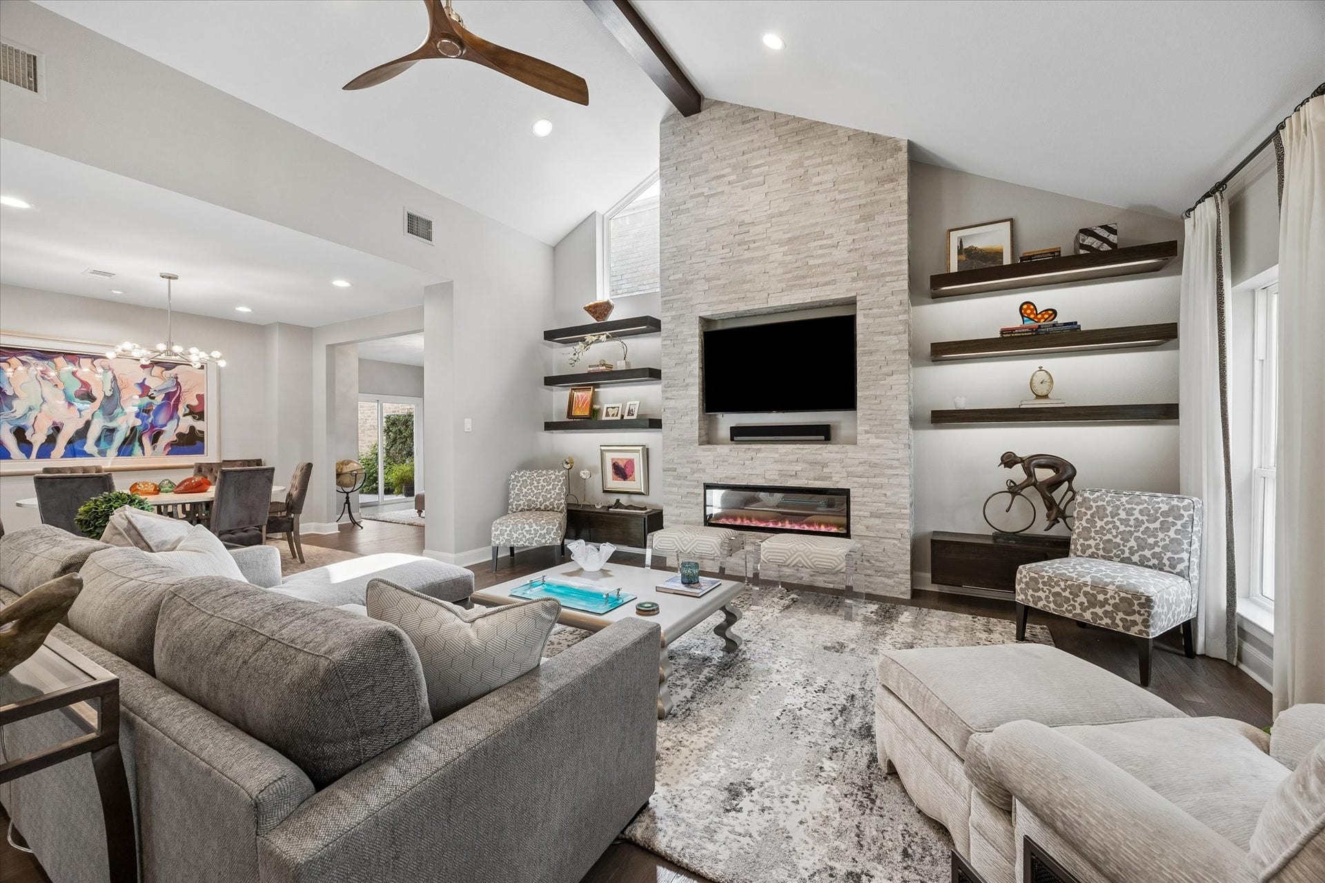 LIVING ROOM II: This light and bright living area is open to the kitchen and dining area which makes it the perfect space for entertaining.