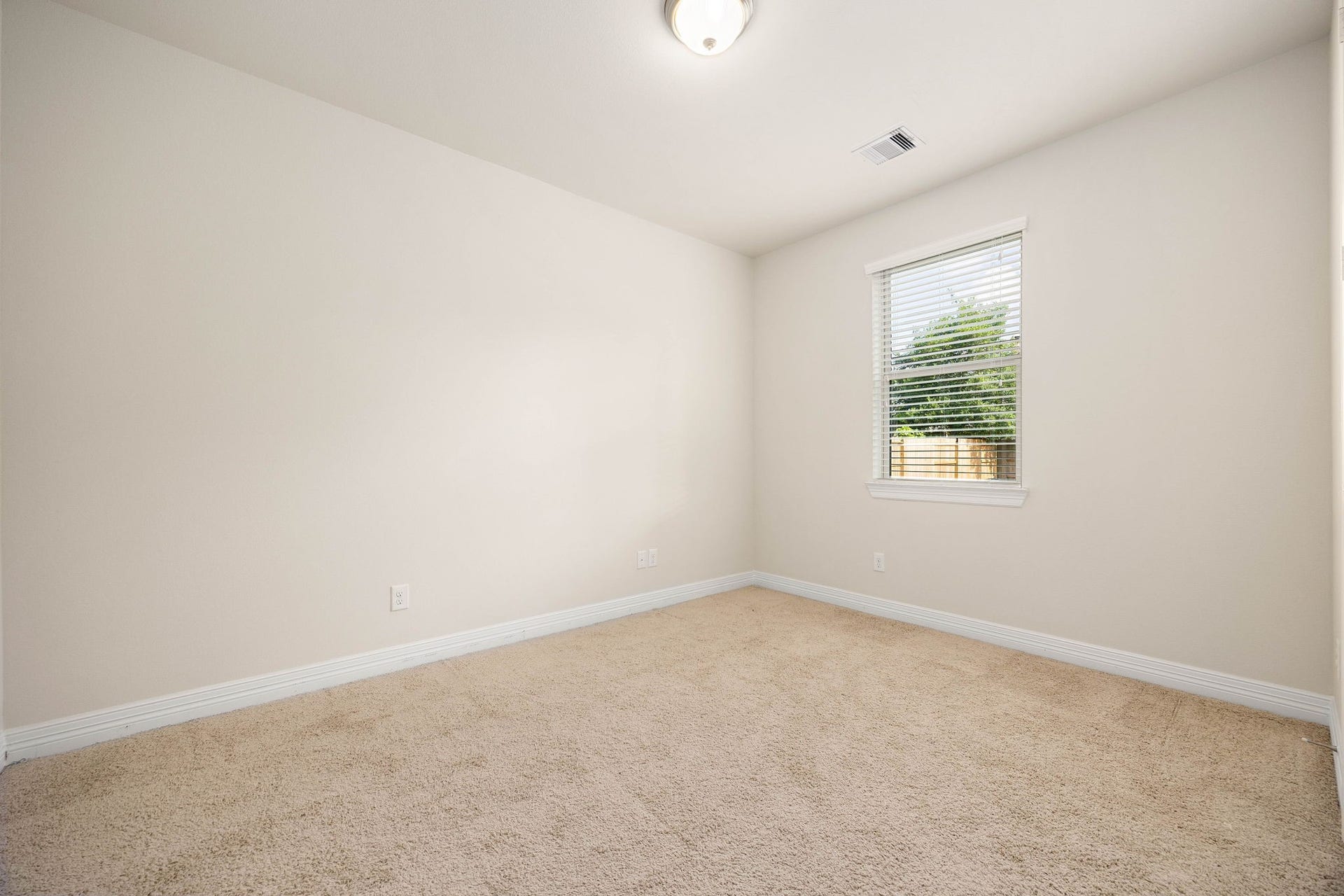 26306 Sunny Springs Lane, Cypress, TX 77433 First floor secondary bedroom is perfect for guests, multi-generational living, or as a flex room with a double door closet.