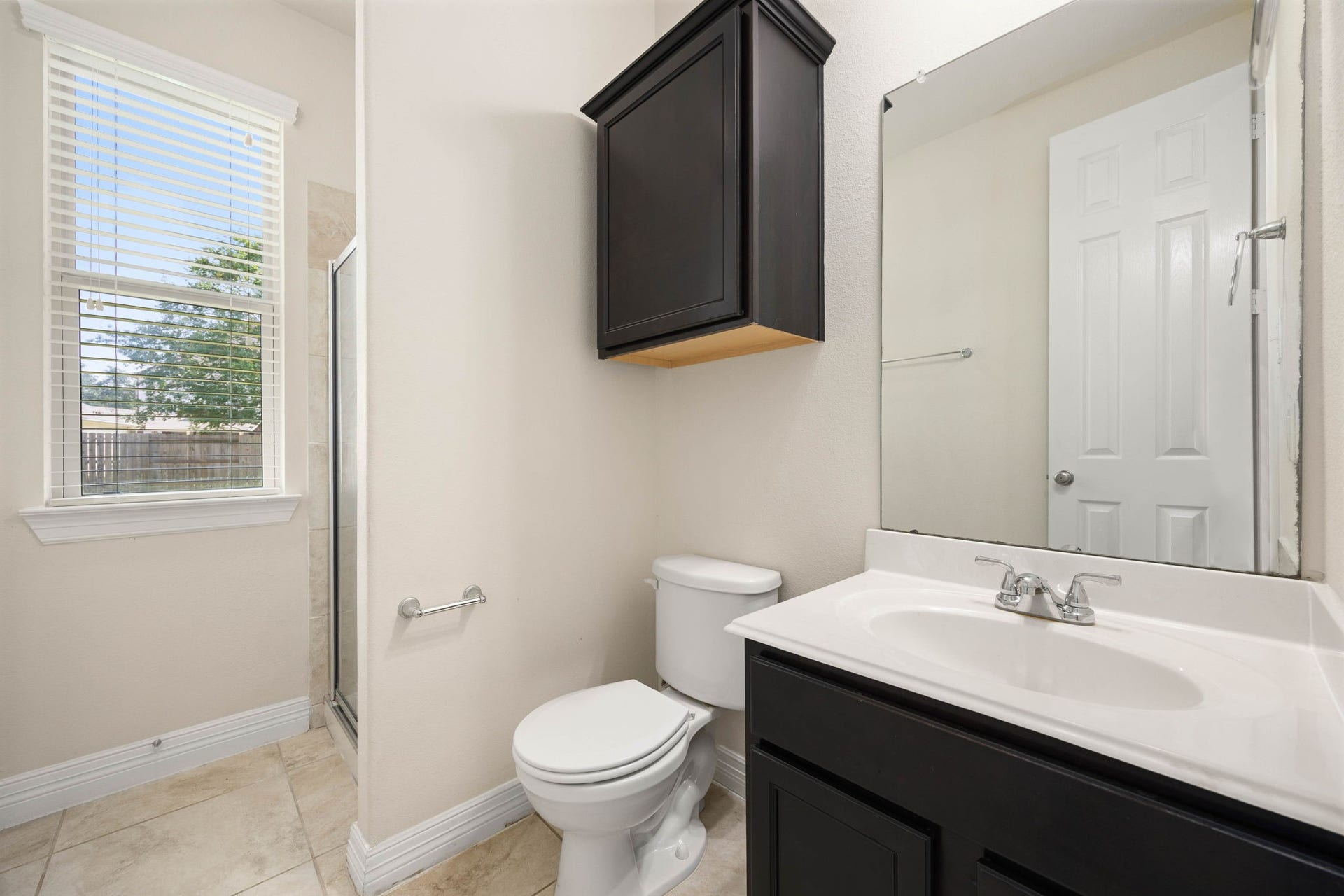 26306 Sunny Springs Lane, Cypress, TX 77433 Full guest bathroom with large linen closet is convenient to the guest room and other visitors to your home.