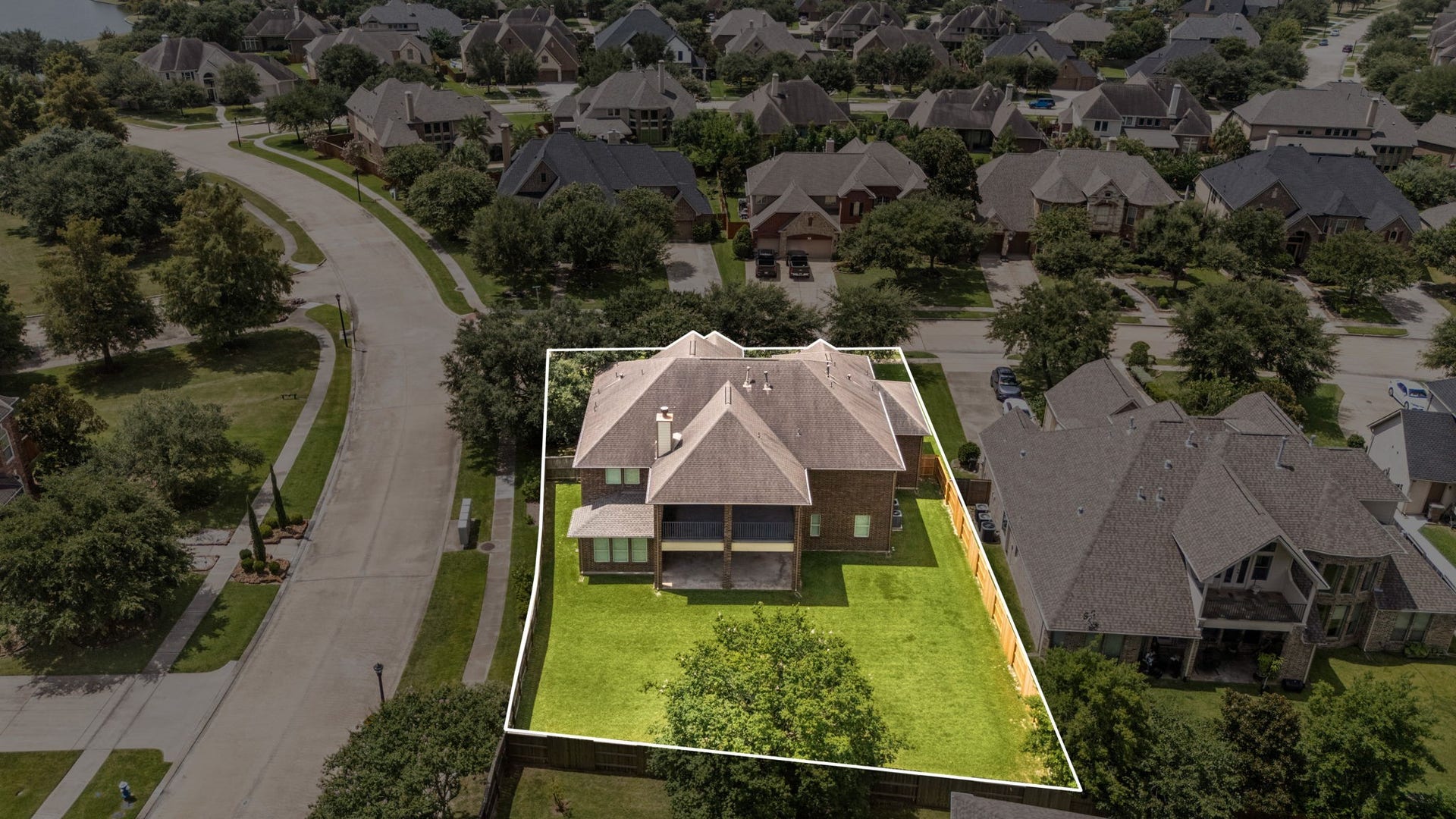 26306 Sunny Springs Lane, Cypress, TX 77433 Aerial view highlights the homes impressive corner lot, large fenced backyard, and substantial outdoor space! This home is also steps from the mailbox central area.