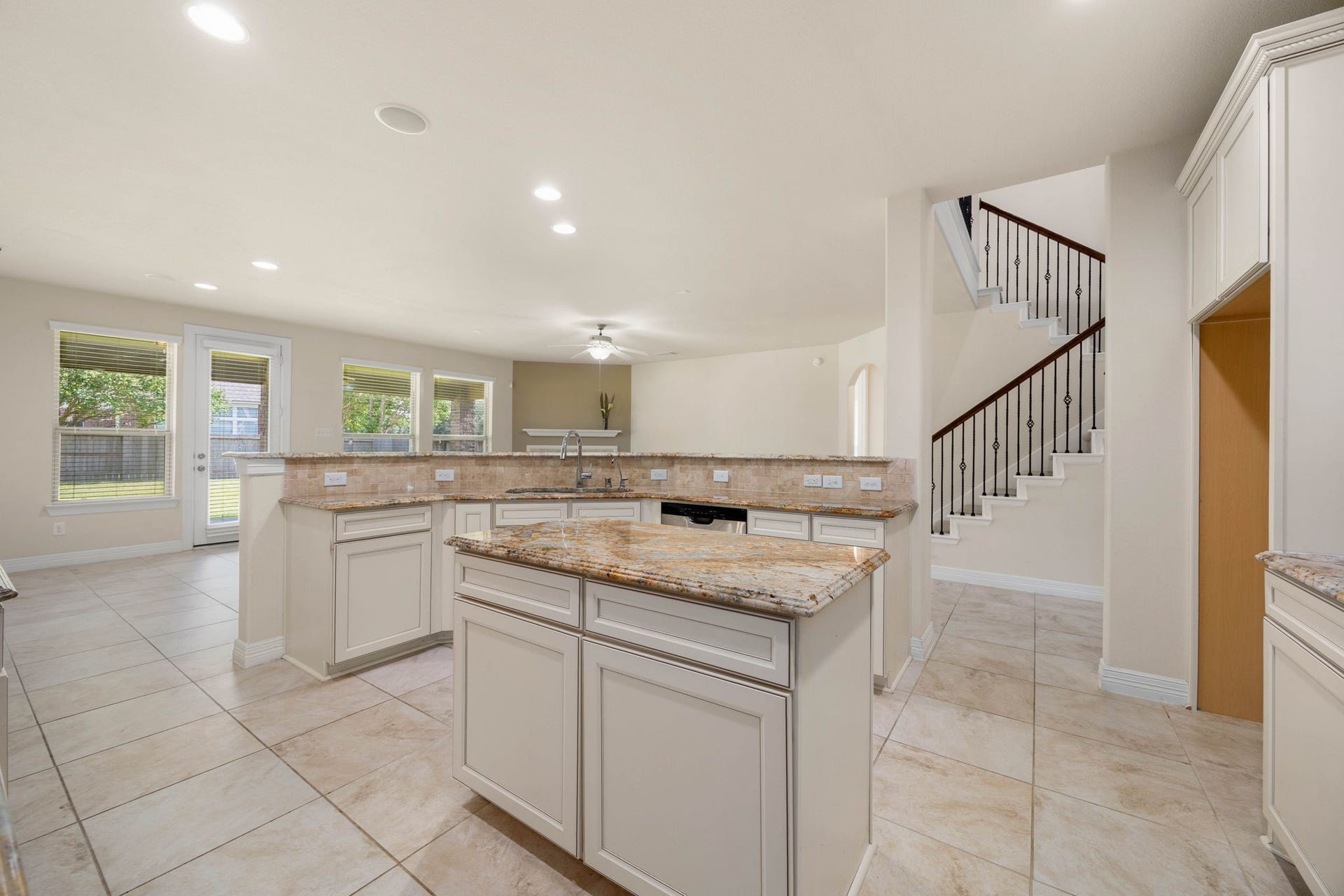 26306 Sunny Springs Lane, Cypress, TX 77433 The spacious kitchen overlooks the breakfast and family areas, creating an easy flow between cooking, dining, and entertaining spaces.