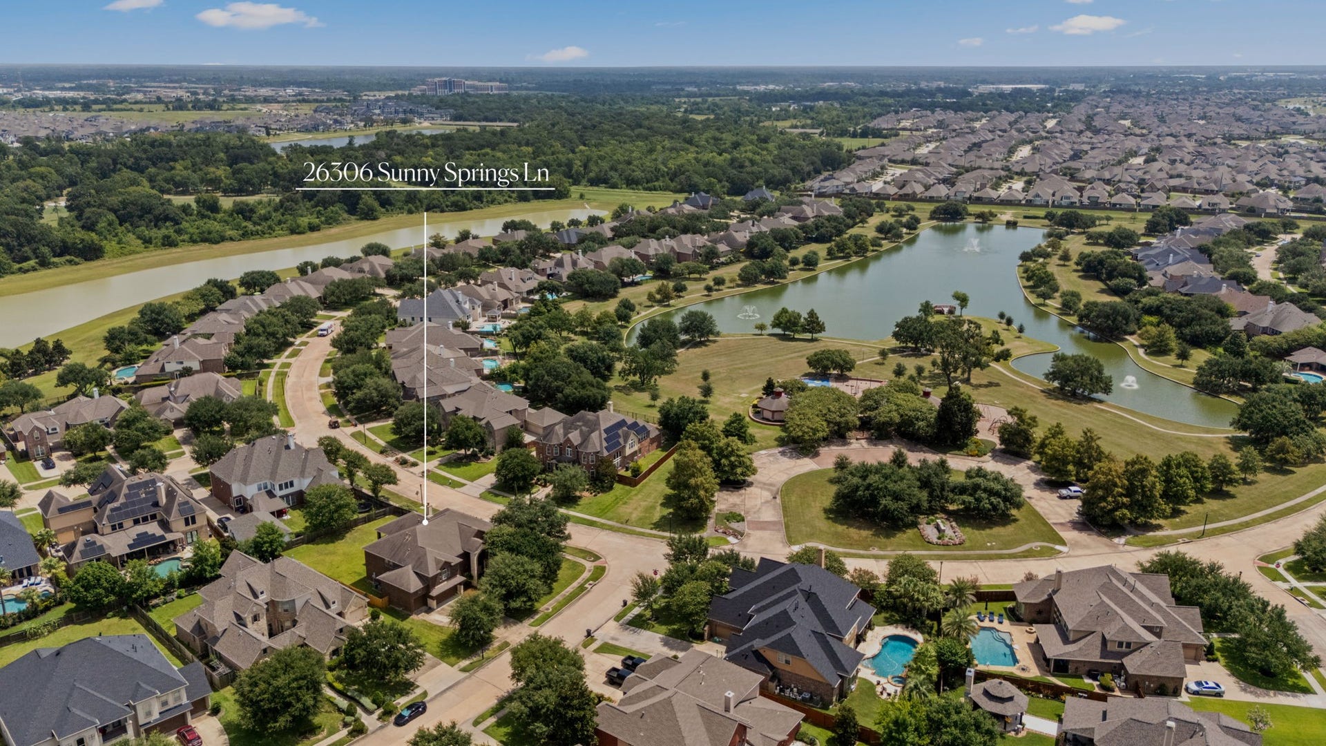 26306 Sunny Springs Lane, Cypress, TX 77433 Front-row access to the neighborhood splashpad, playground, lake, walking trails, and dock.
