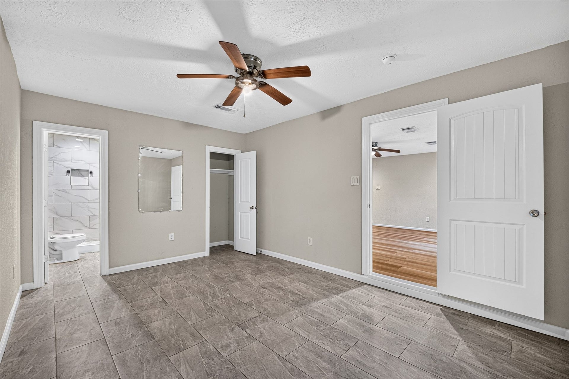 Primary bedroom showing entry off the living room area.
