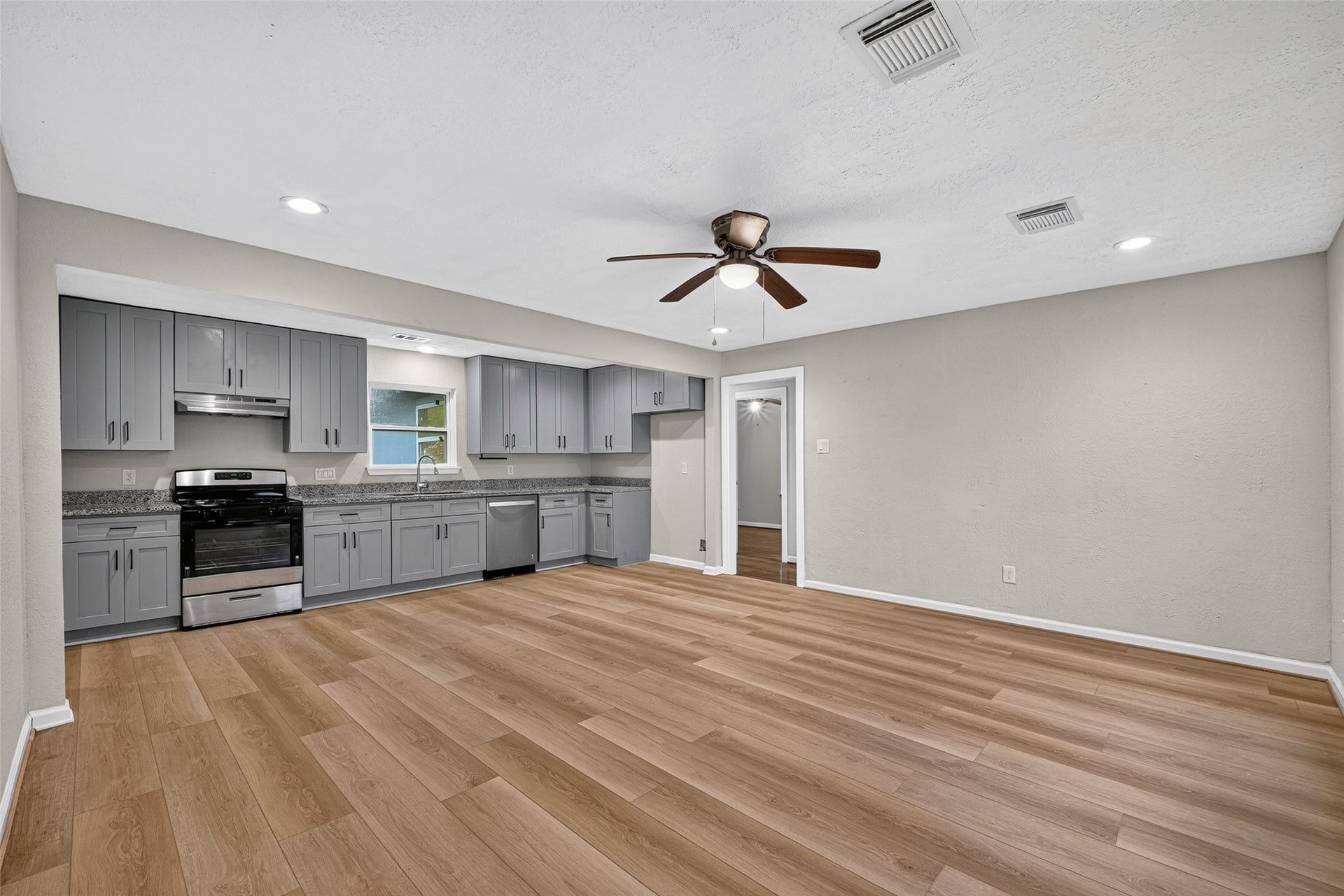 The kitchen is open and updated to including granite countertops and much more.