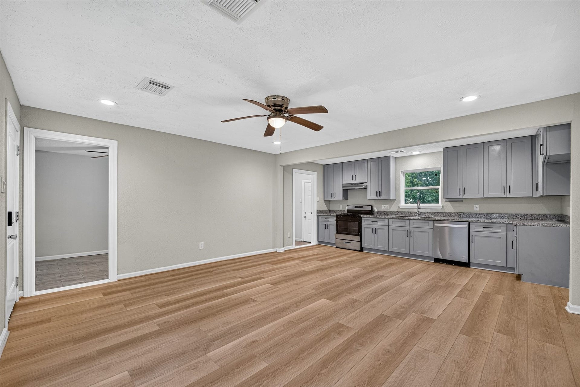 The recently remodeled property highlights wood vinyl planks.