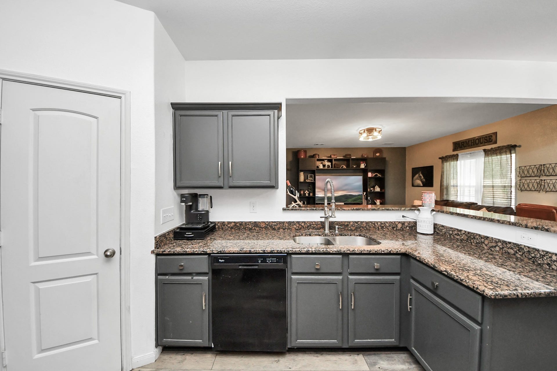 415 Hawks View Drive, La Marque, TX 77568 L shape island open concept, with living area and dining.