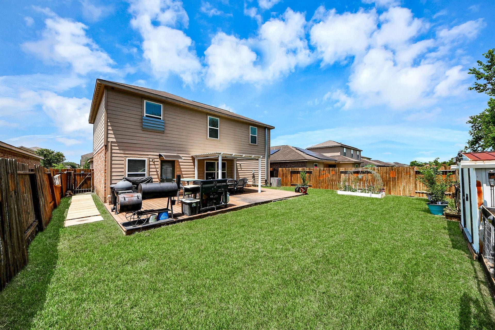 415 Hawks View Drive, La Marque, TX 77568 View from corner of the home. Spacious yard