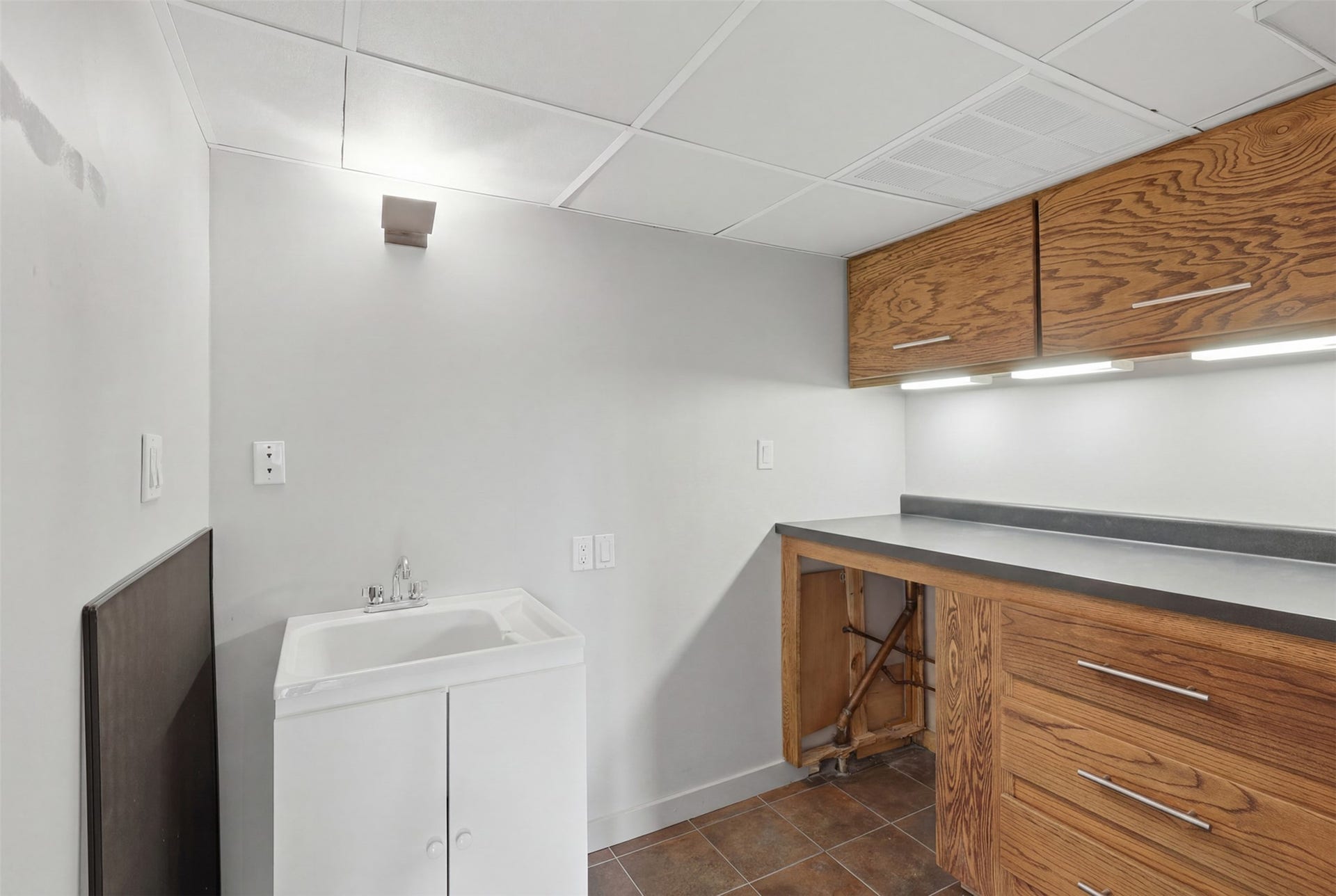 A rare utility room IN the condo.