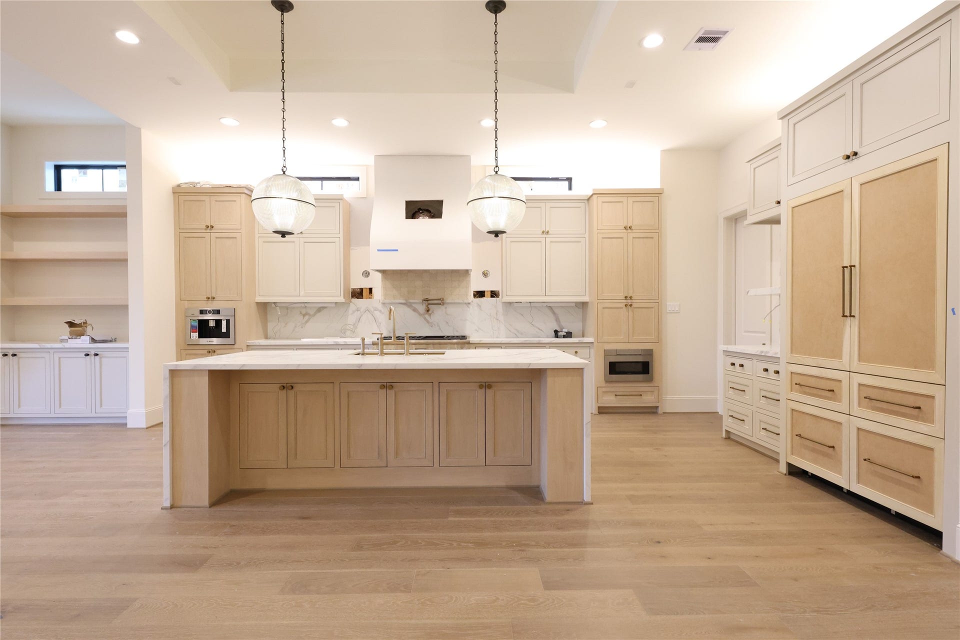 752 W 43rd Street, Houston, TX 77018 Chefs Kitchen offers a quartz island, 48" Thermador Appliances, Panel-front Refrigerator & Dishwasher, built-in Bosch Coffee-maker, Pot-filler, custom site-built cabinetry, Skullery/Butlers pantry around the corner with 2nd dishwasher & 2nd sink.