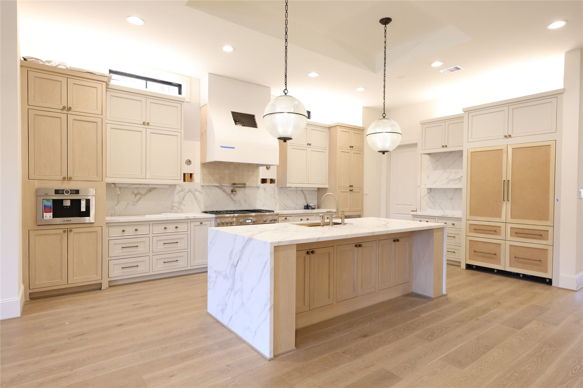 752 W 43rd Street, Houston, TX 77018 Chefs Kitchen offers a quartz island, 48" Thermador Appliances, Panel-front Refrigerator & Dishwasher, built-in Bosch Coffee-maker, Pot-filler, custom site-built cabinetry, Skullery/Butlers pantry around the corner with 2nd dishwasher & 2nd sink.