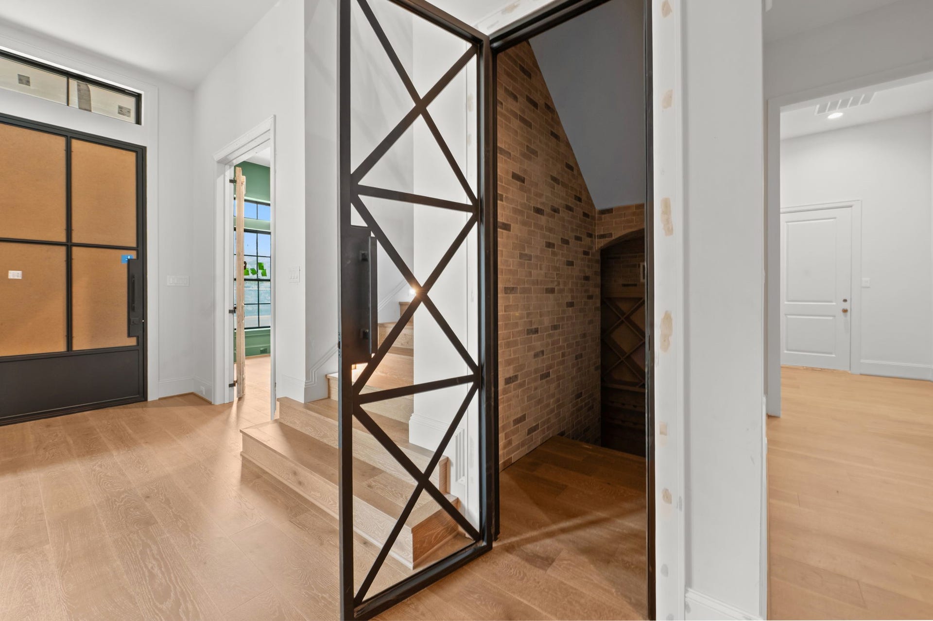 752 W 43rd Street, Houston, TX 77018 Below ground temp-controlled wine room offers abundant storage with interior brick and stone, custom wine racks & gorgeous fixtures.