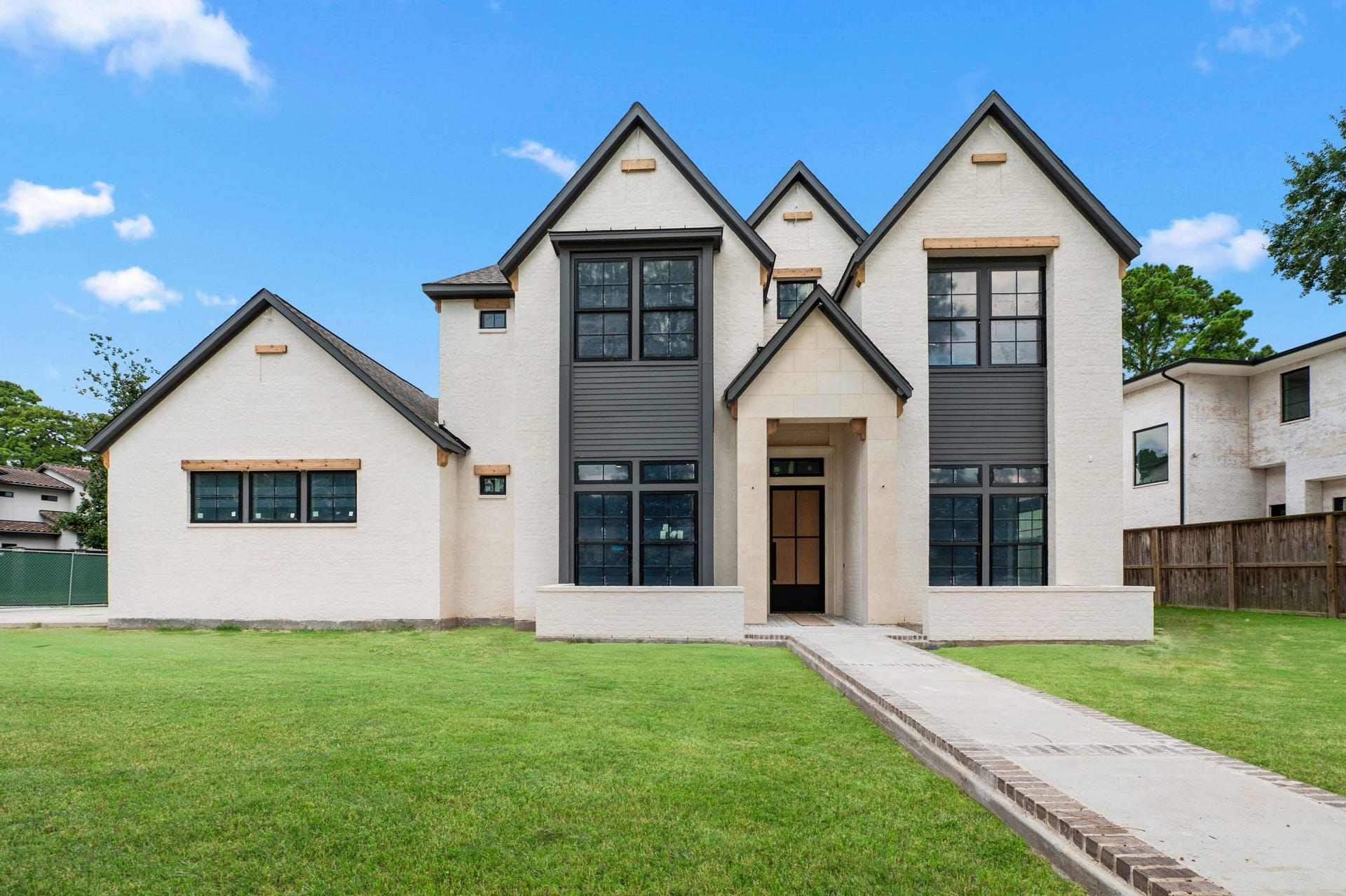 752 W 43rd Street, Houston, TX 77018 Home offers brick exterior with cast stone at front entrance. Walkway will be bricked as well with designer landscaping at front entry. *Construction Progress Photo taken 7/30/26