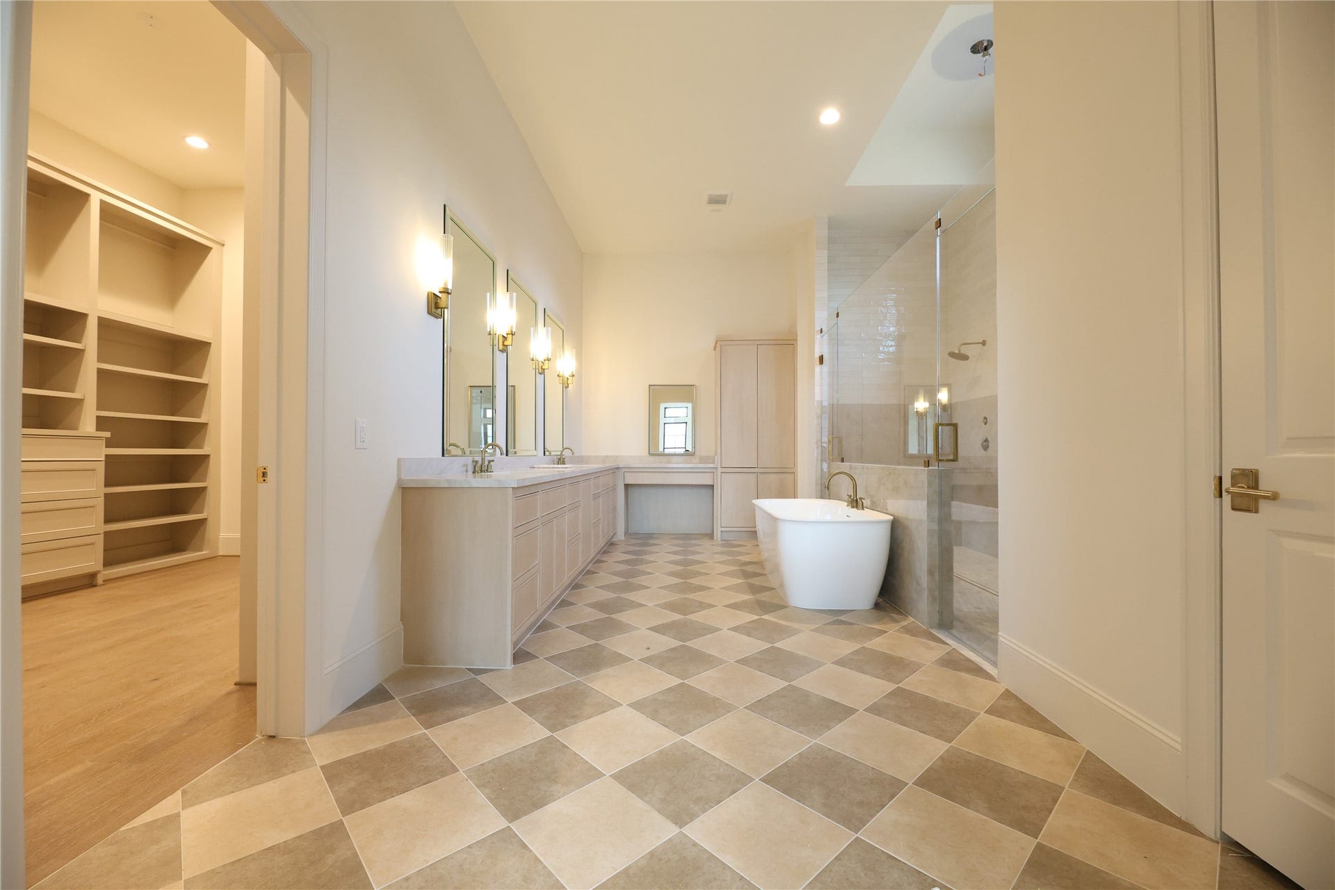 752 W 43rd Street, Houston, TX 77018 Primary Bathroom offers custom site-built dual vanity w/ linen built-in and extra large walk-in shower & soak tub.
