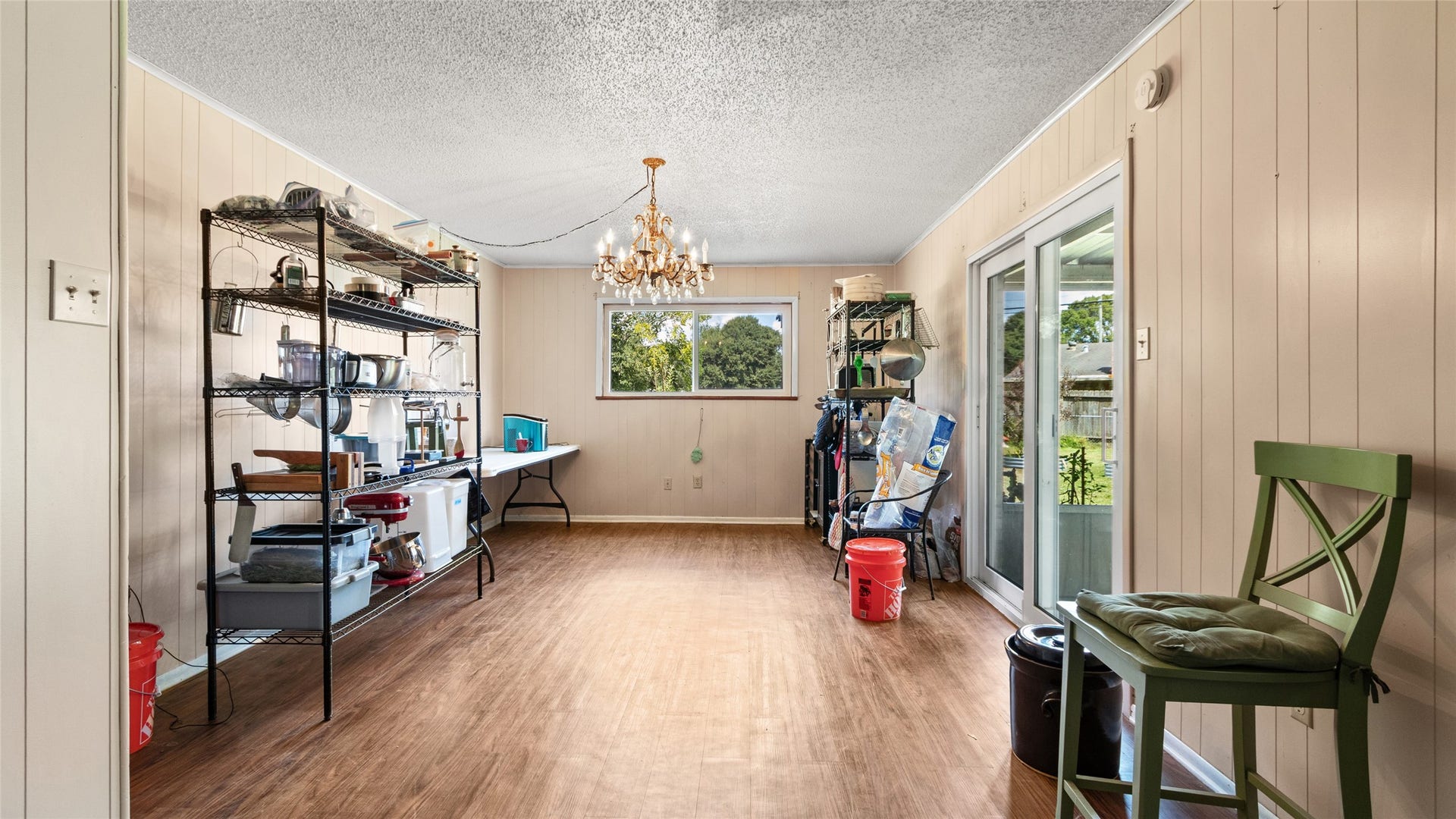 503 Allen Court, Alvin, TX 77511 Formal dining area offers generous space for entertaining, abundant natural light, and direct access to the covered patio for easy indoor-outdoor living.