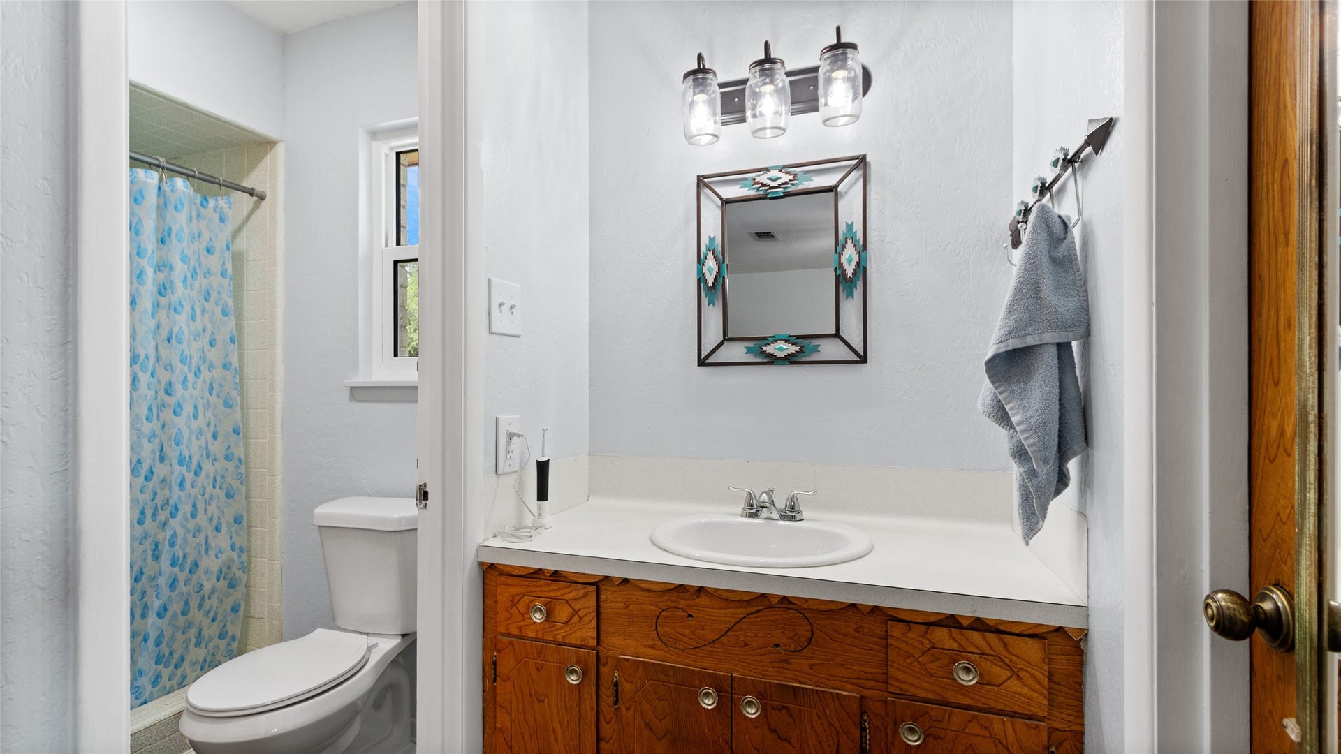 503 Allen Court, Alvin, TX 77511 Full bathroom features a generous vanity with ample counter space, tub/shower combination, and a window providing natural light.