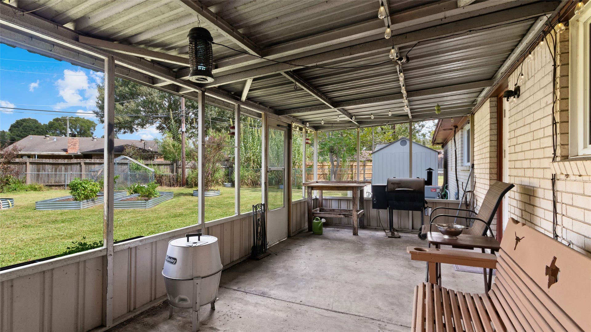 503 Allen Court, Alvin, TX 77511 Another view of the expansive covered and screened patio, offering plenty of room for outdoor living and entertaining with direct access to the backyard.