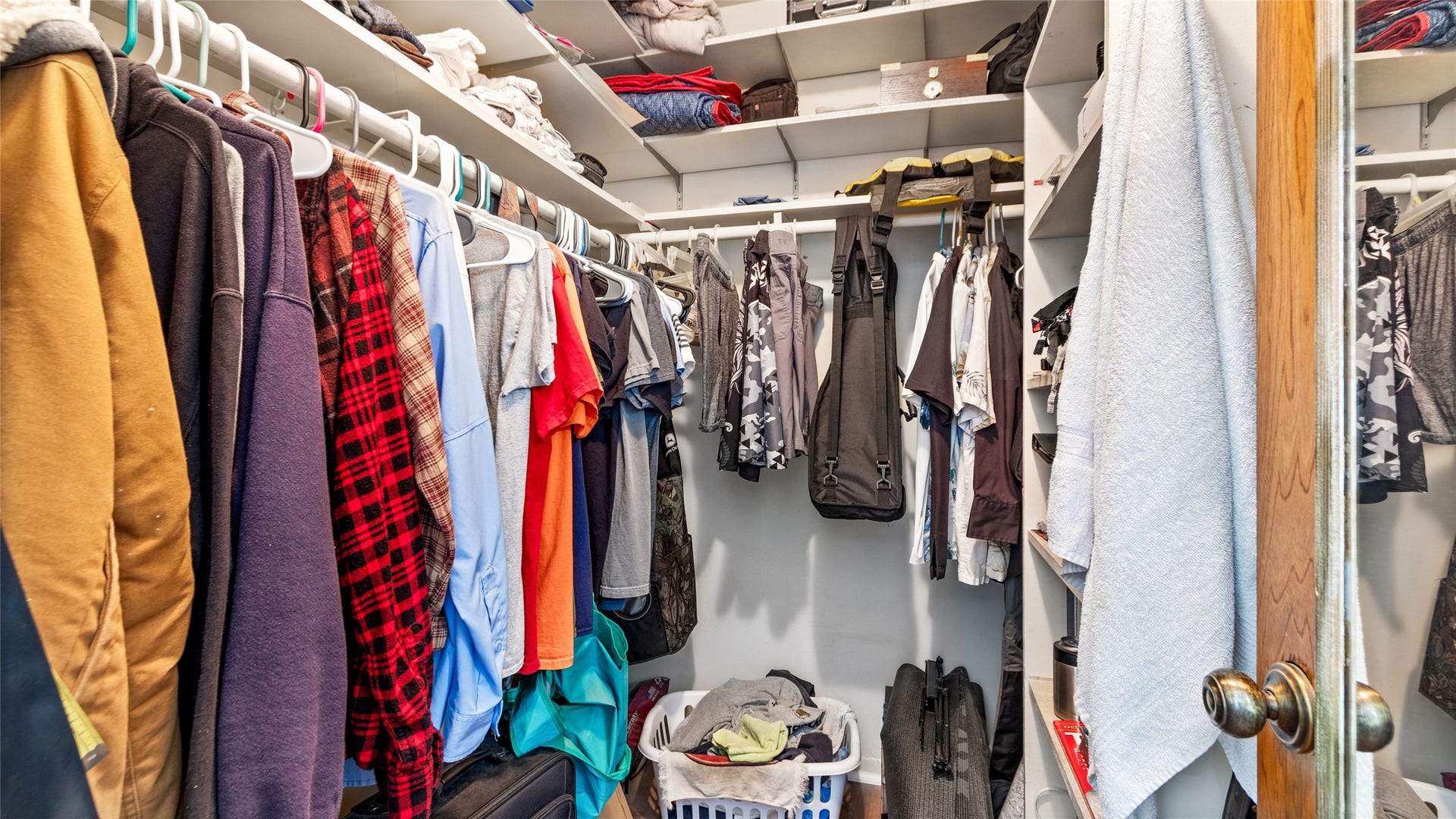 503 Allen Court, Alvin, TX 77511 Generous walk-in closet offers abundant hanging space and built-in shelving for organized storage.
