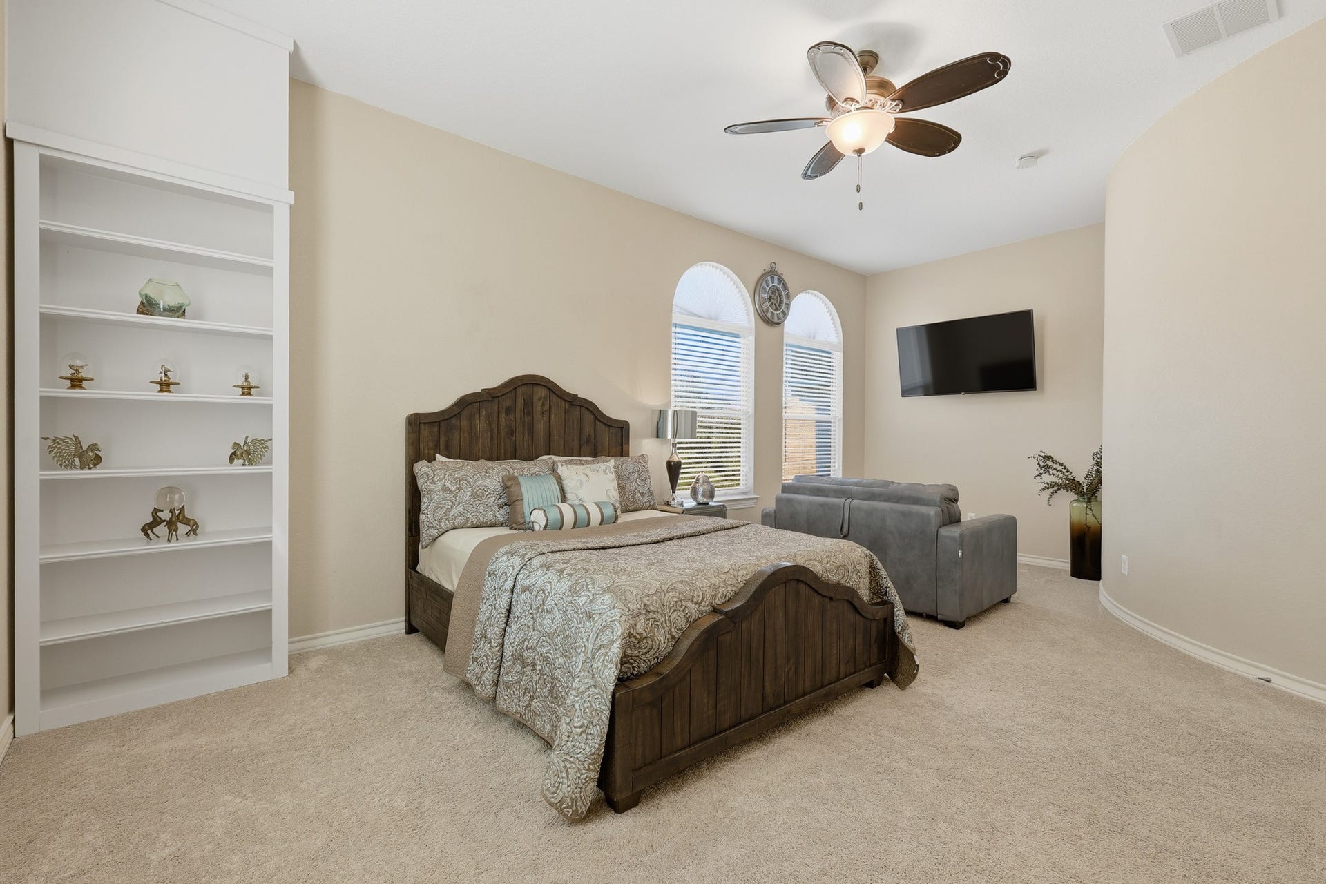 Spacious and inviting, this upstairs secondary bedroom offers a comfortable private retreat with elevated ceilings that enhance the open, airy feel. Multiple windows allow natural light to pour in, highlighting the rooms architectural details and creating a bright, welcoming ambiance. The thoughtfully designed layout provides ample space for a sitting area or workspace, while direct access to a well-appointed bath adds convenience and privacy. Ideal for family members or guests.