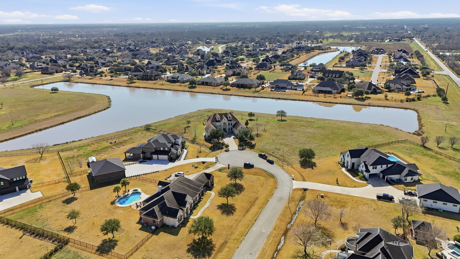 Located in the exclusive Lakes of Mission Grove, this property combines luxury estate living with spacious homesites, scenic surroundings, and the tranquility of Richmonds premier acreage community.