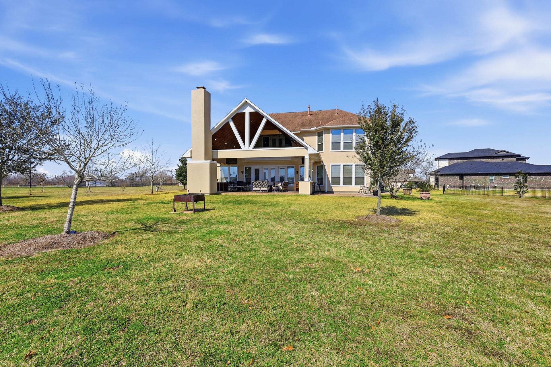 Set on a beautifully sized lawn with open sightlines and peaceful surroundings, this backyard offers the perfect blend of privacy and possibilityideal for creating a custom pool, garden retreat, or extended outdoor oasis. Seamless indoor-outdoor flow and grand-scale design make this space both refined and resort-inspired.
