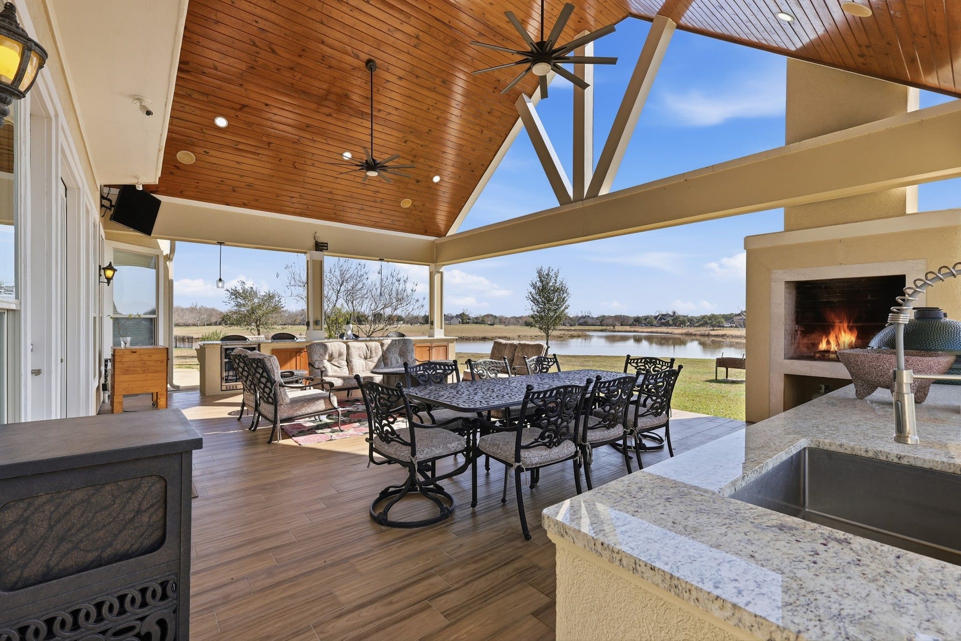 From intimate evenings by the fire to lively dinner parties under the vaulted timber ceiling, this outdoor retreat offers seamless indoor-outdoor luxury. Thoughtfully designed seating areas, built-in grilling station, and uninterrupted lake views elevate every occasion.