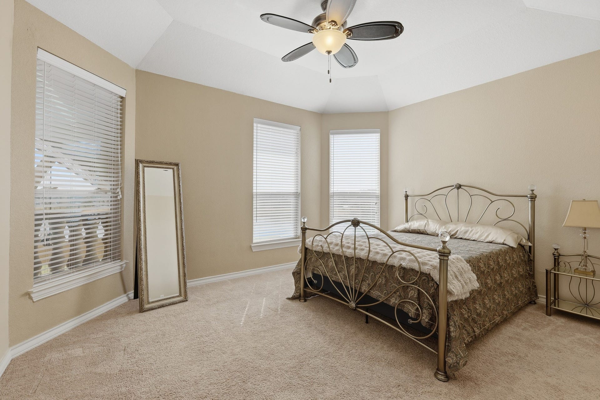 Beautifully appointed upstairs secondary bedroom offers comfort and versatility with a touch of elegance. Vaulted ceilings enhance the sense of space, while multiple windows invite abundant natural light, creating a warm and airy atmosphere. Crisp architectural lines and an open layout provide a refined canvas ready to suit a variety of lifestyle needswhether designed as a stylish guest retreat or a private personal haven. Thoughtfully positioned on the 2nd floor, this bedroom provides privacy and comfort.