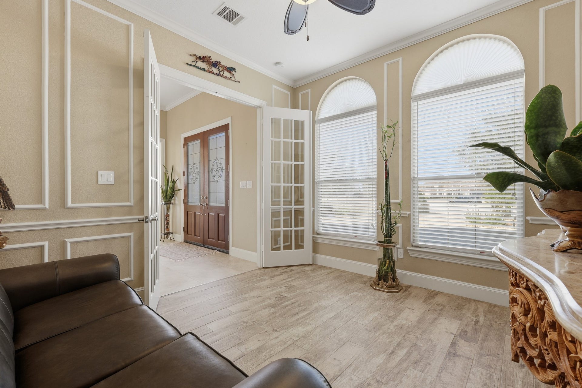 Perfectly suited as an intimate sitting room, executive home office, or private study, the rooms French doors open gracefully to the foyer, enhancing flow and flexibility. The generous proportions and abundant light make this an inspiring setting for both quiet relaxation and productive work-from-home living.