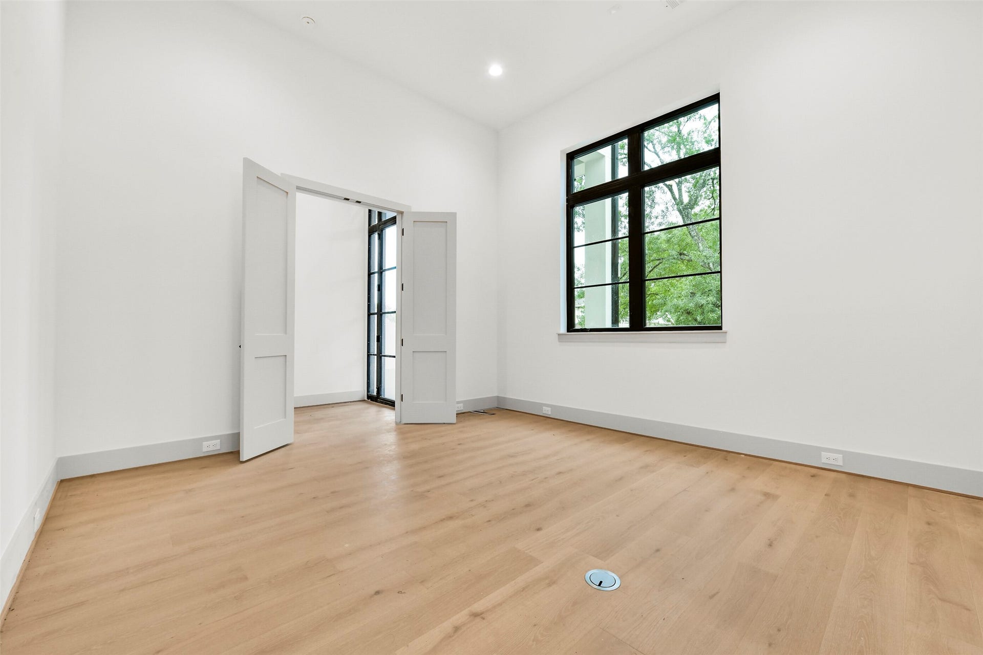 The first floor study features large picture windows, 14 foot tall ceilings and an ensuite bath with walk-in closet so it could be used as a 5th bedroom.