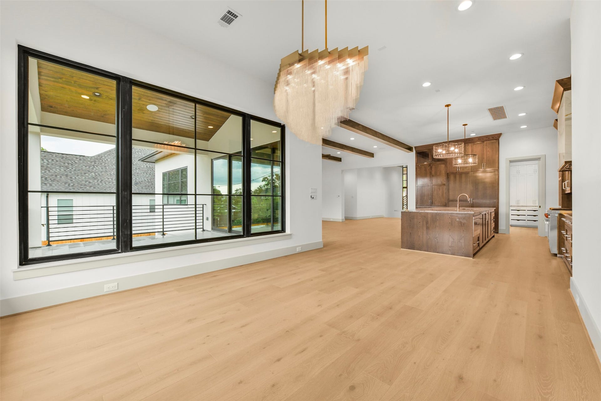 The formal dining room is perfect for everyday use or your most extravagant dinner party. The elegant chandelier and picture windows on two sides fill the space with light.