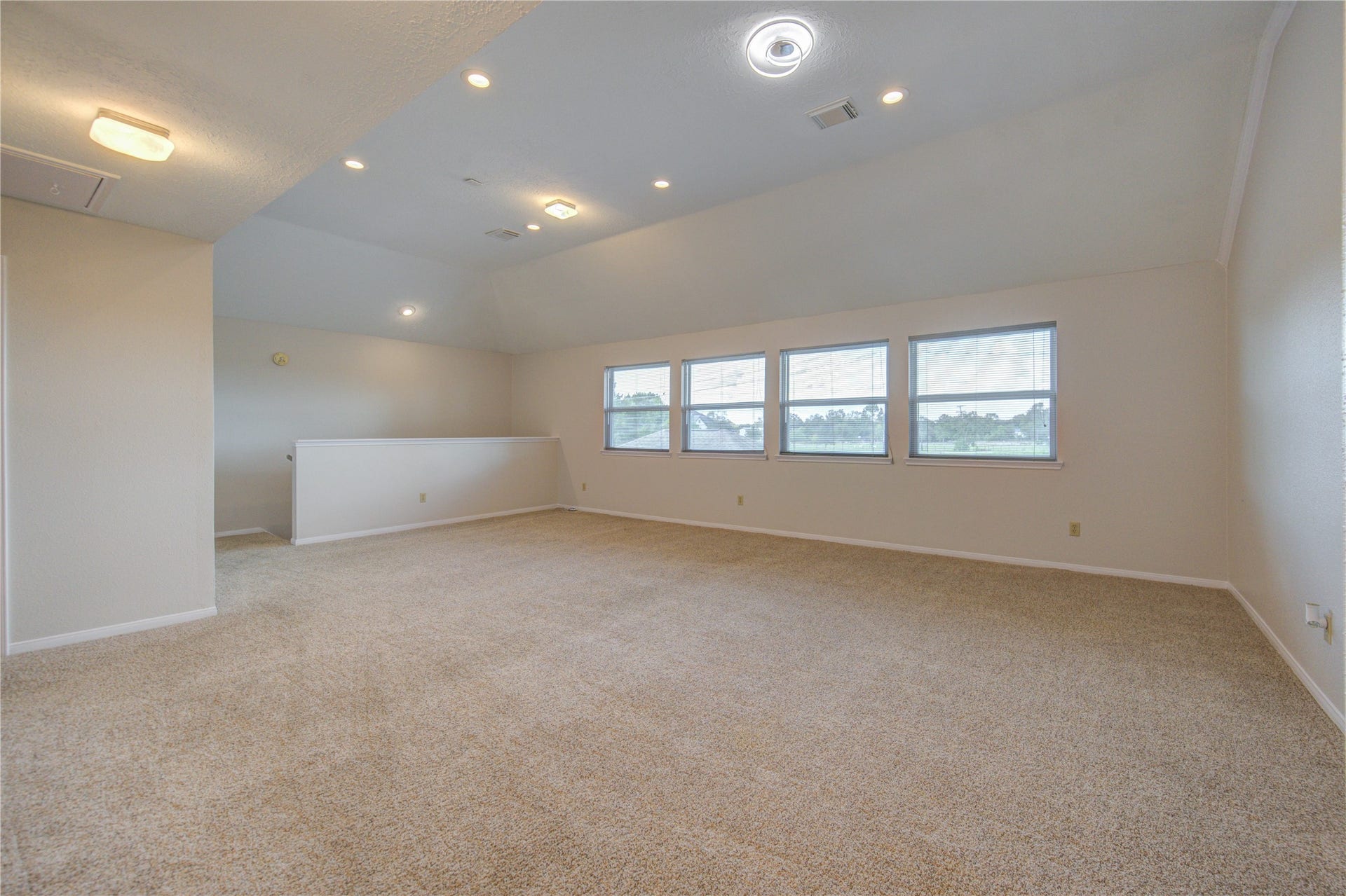 1016 Applewood Drive, Friendswood, TX 77546 Large Game Room with plenty of space and a secondary staircase to the kitchen area