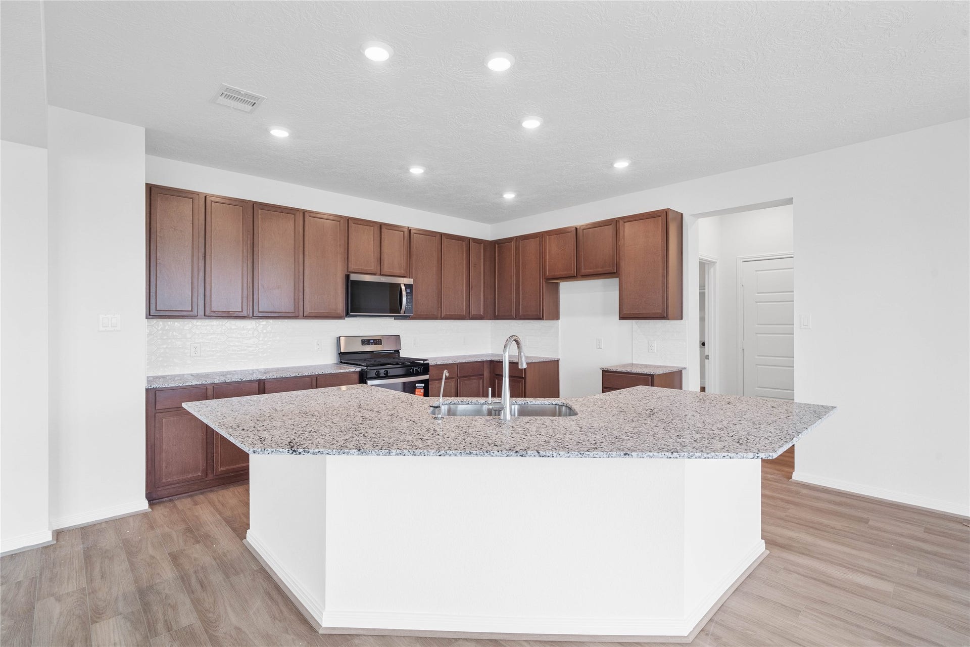 This spacious kitchen has it allample storage, generous counter space, and a layout that truly makes it the heart of the home.