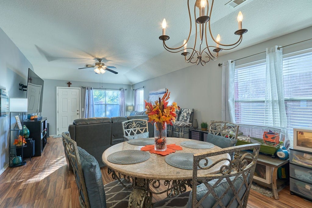 5934 Spring Sunrise Drive, Richmond, TX 77407 Gather around the table! A light-filled dining space perfect for everyday meals and memorable celebrations.