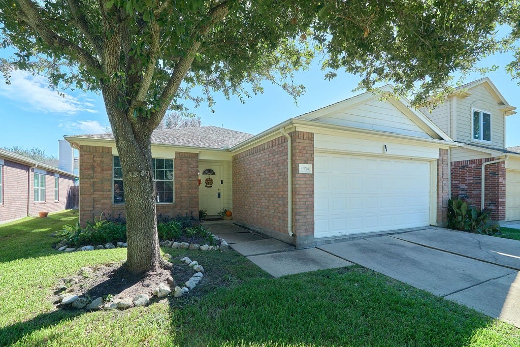 5934 Spring Sunrise Drive, Richmond, TX 77407 Welcome home! Charming curb appeal, mature shade trees, and an inviting entrance set the stage for comfortable living.