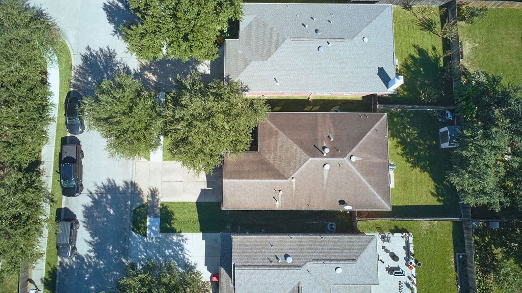 5934 Spring Sunrise Drive, Richmond, TX 77407 Discover the property from above! An elevated perspective highlights the home and its surrounding residential setting.