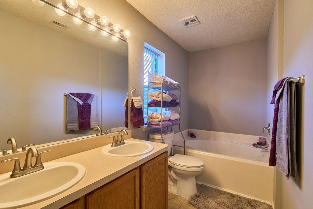 5934 Spring Sunrise Drive, Richmond, TX 77407 Start and end your day in comfort with this conveniently designed bathroom featuring a generous vanity.