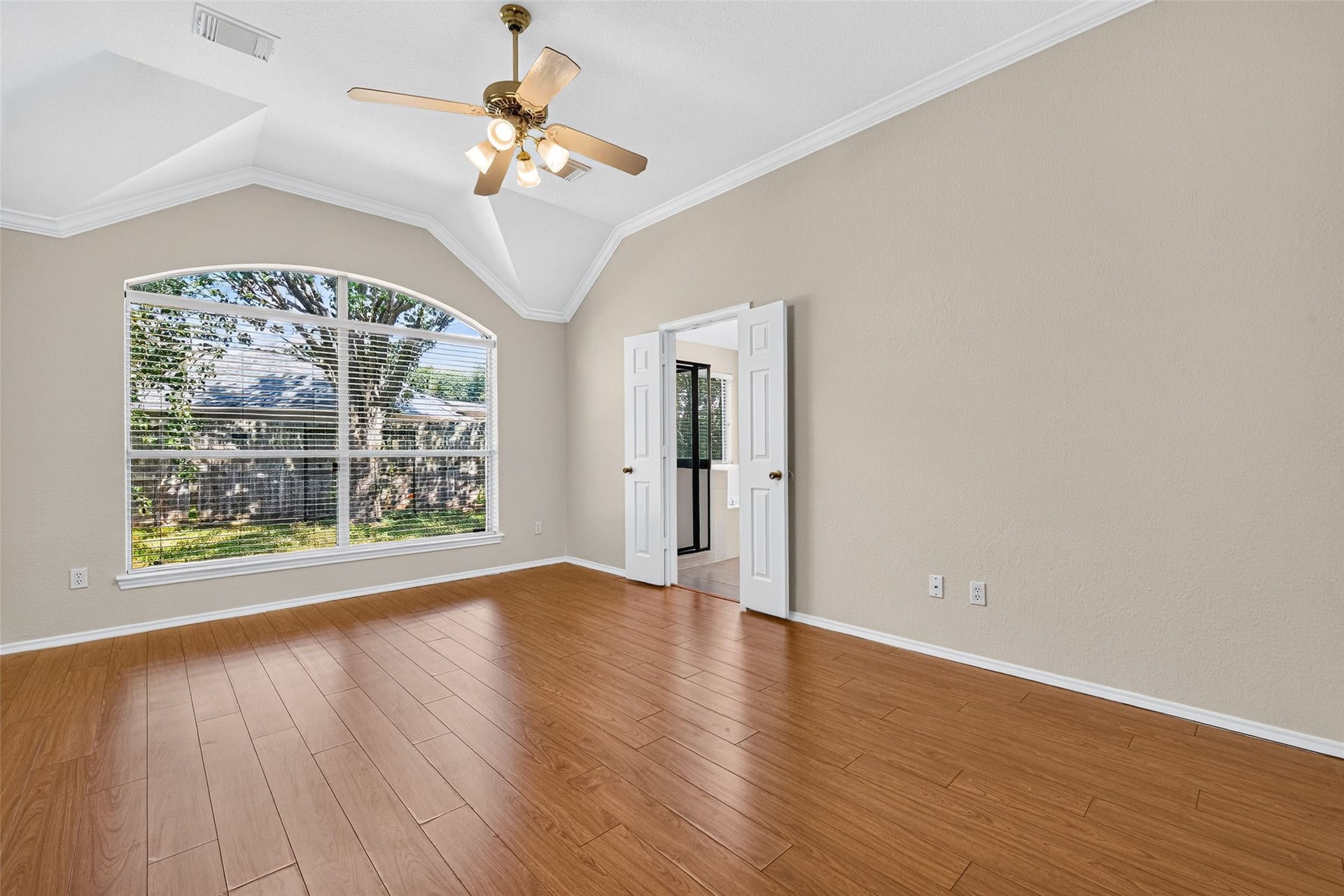 4903 Chappel Hill Drive, Missouri City, TX 77459 Primary bedroom features a high ceiling and a large window that allows for an abundance of natural light
