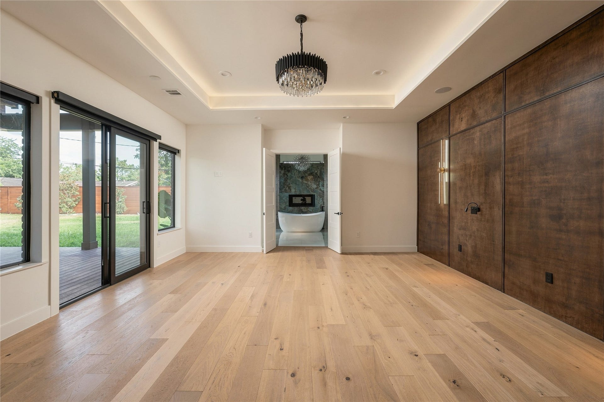 2510 Underwood Street, Houston, TX 77030 Primary Bedroom with Custom Wood Accents, Lighting, and Backyard Access