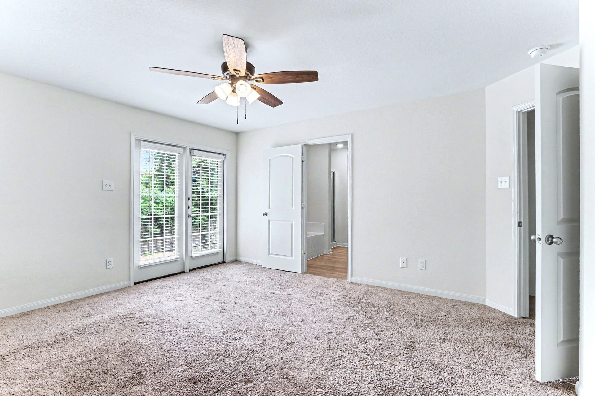 22622 Steel Blue Jaybird Drive, Hockley, TX 77447 The primary bedroom has French doors going out to the back yard.