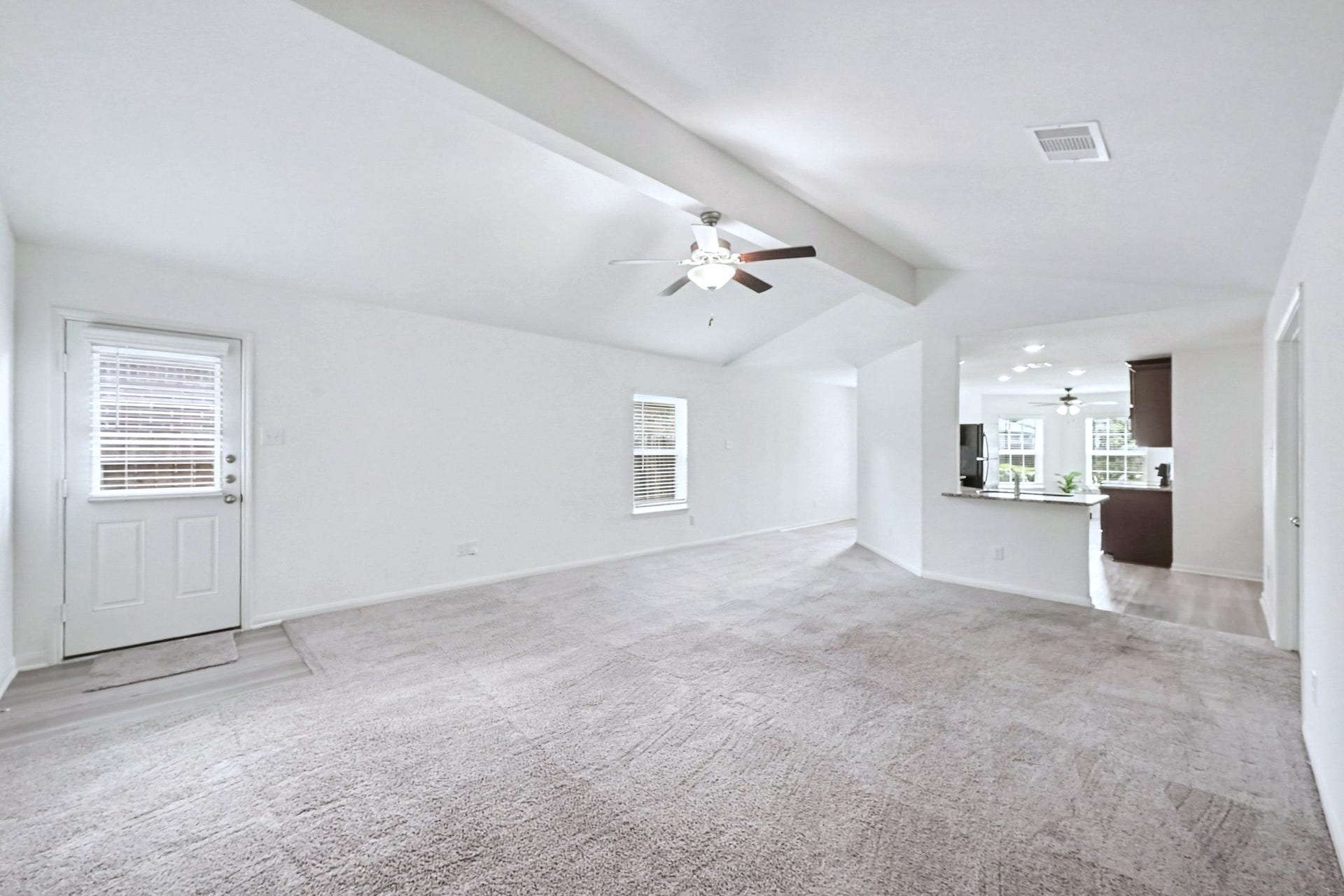 22622 Steel Blue Jaybird Drive, Hockley, TX 77447 Easy flow between the living space and the kitchen