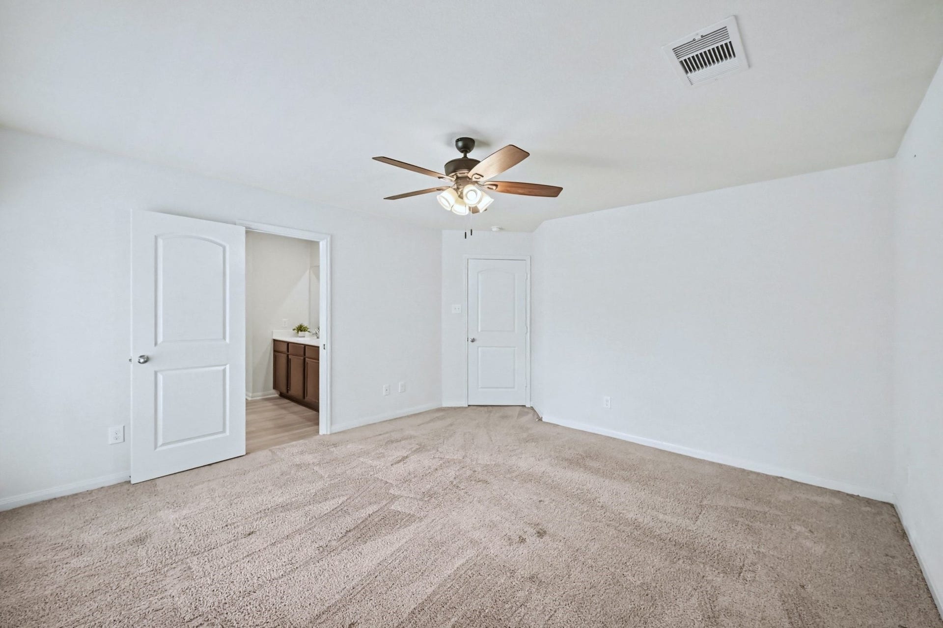 22622 Steel Blue Jaybird Drive, Hockley, TX 77447 Primary bedroom looking toward the entry door and bathroom