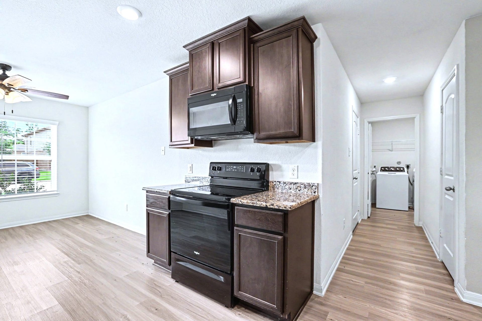 22622 Steel Blue Jaybird Drive, Hockley, TX 77447 The utility room is right down the hall from the kitchen.