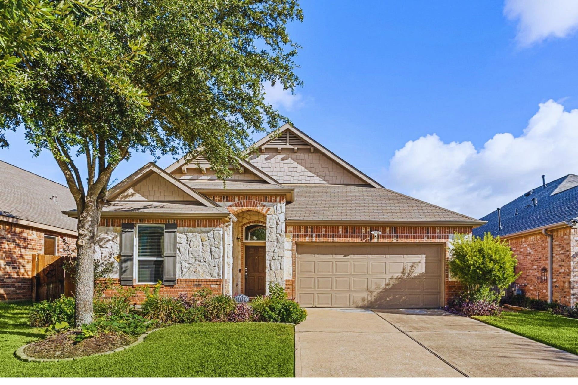 24114 Buffalo Cove Lane, Katy, TX 77493 Welcome to 24114 Buffalo Cove Lane, a charming one-story home in the Katy Oaks community, featuring a brick and stone exterior, mature shade tree, and a two-car attached garage with a double-wide driveway.
