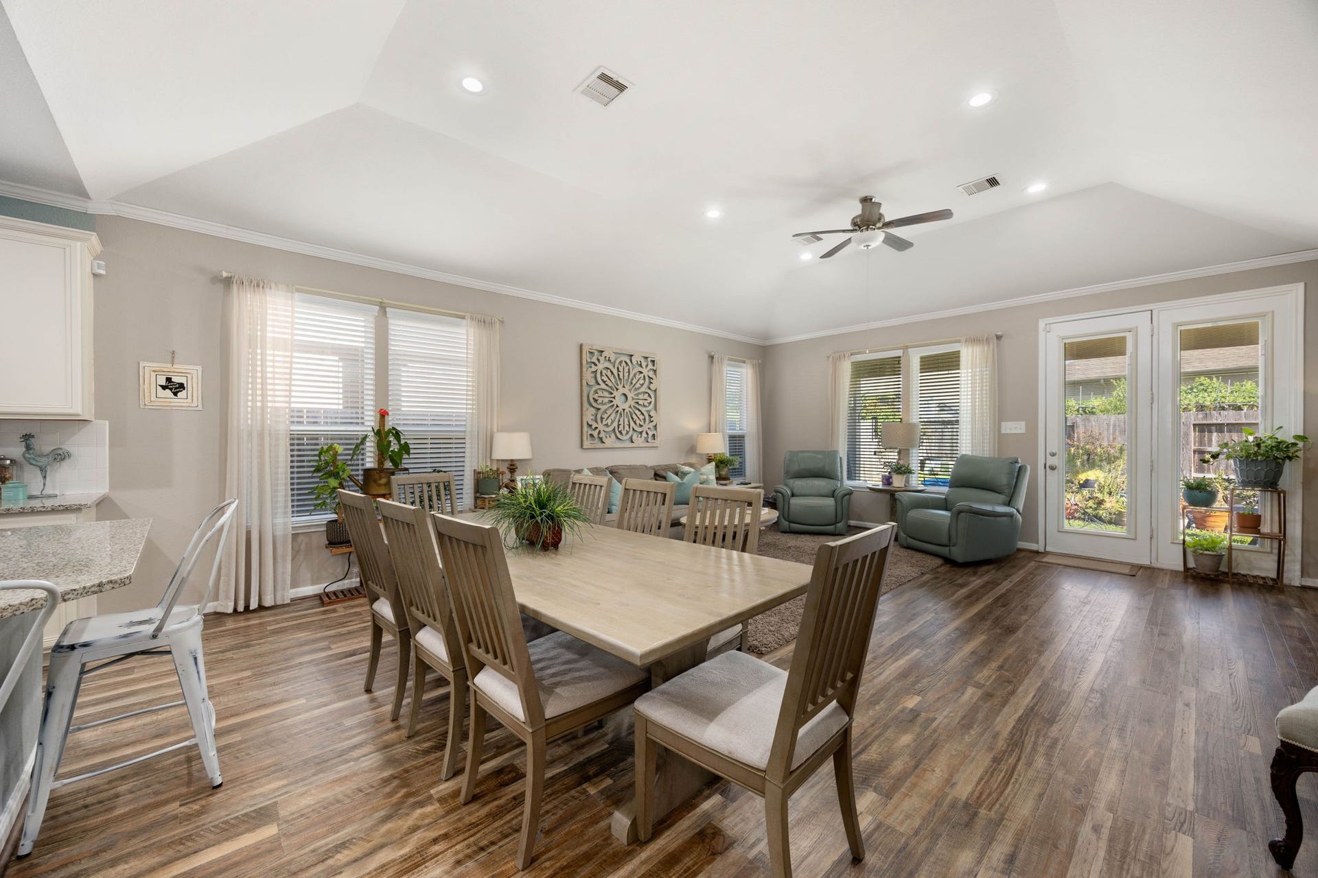 24114 Buffalo Cove Lane, Katy, TX 77493 Oversized windows bring plenty of natural light into the dining & living area, which opens directly to the backyard.